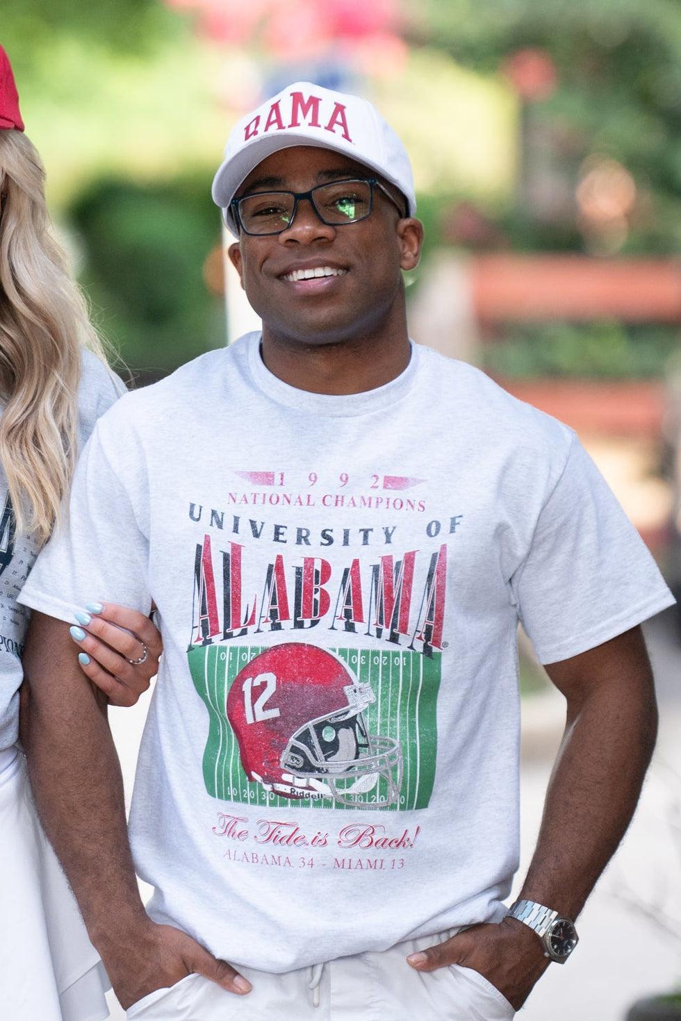 University of Alabama 1992 National Champions Comfort Colors Grey T-Shirt with a graphic print of a football helmet and the text '1992 National Champions UNIVERSITY OF ALABAMA'.