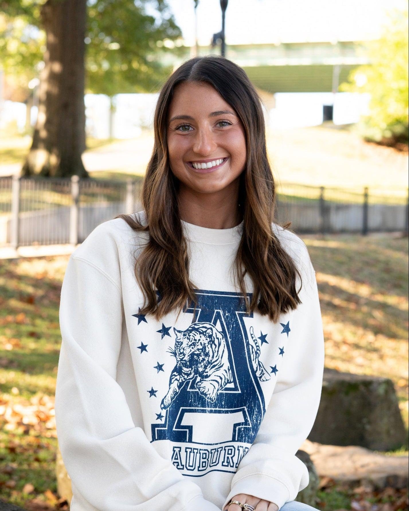 Auburn University Ivory Sweatshirt with Navy stars surrounding a Navy Leaping Tiger Logo