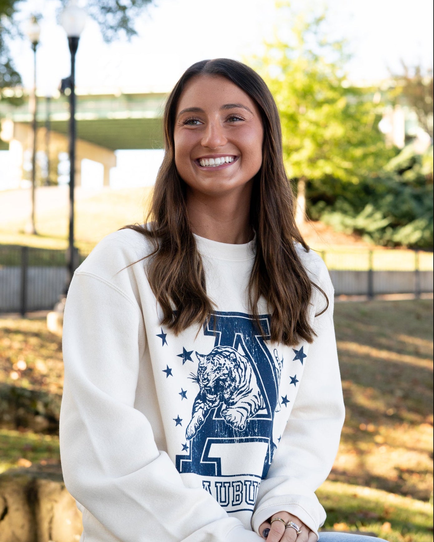 Auburn University Ivory Sweatshirt with Navy stars surrounding a Navy Leaping Tiger Logo