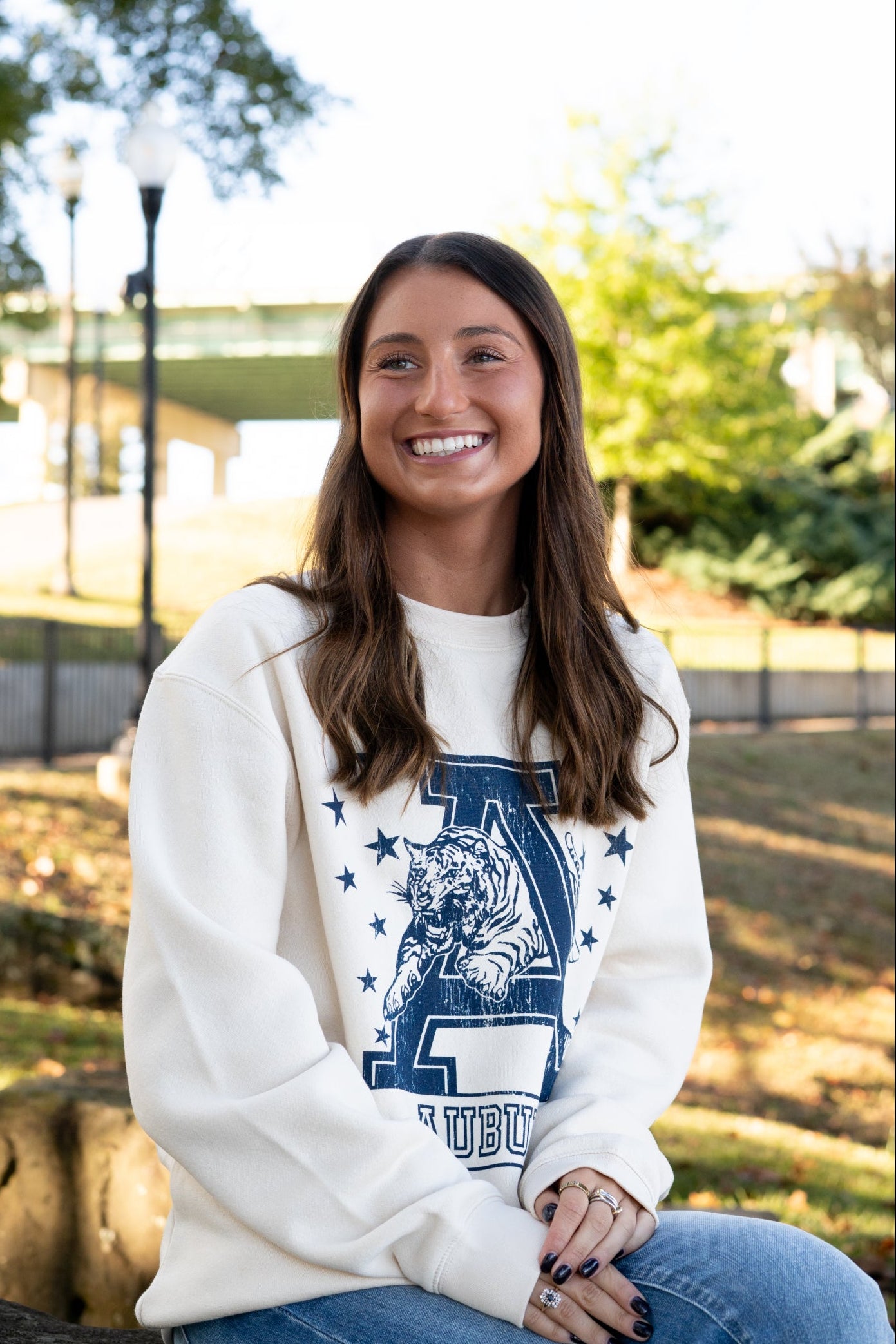 Auburn University Ivory Sweatshirt with Navy stars surrounding a Navy Leaping Tiger Logo
