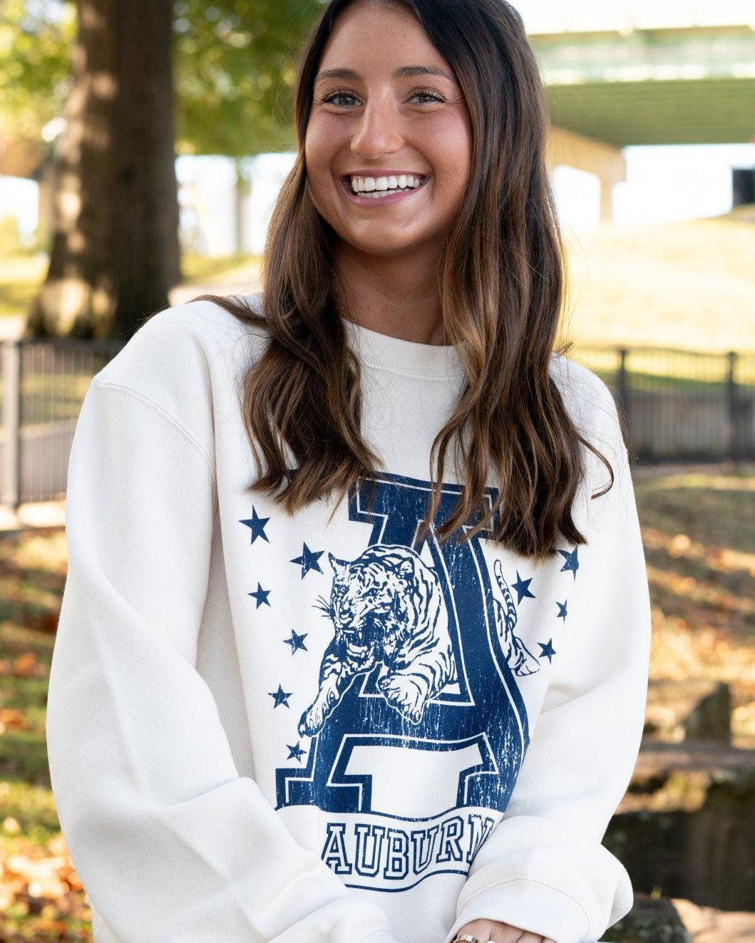 Auburn University Ivory Sweatshirt with Navy stars surrounding a Navy Leaping Tiger Logo