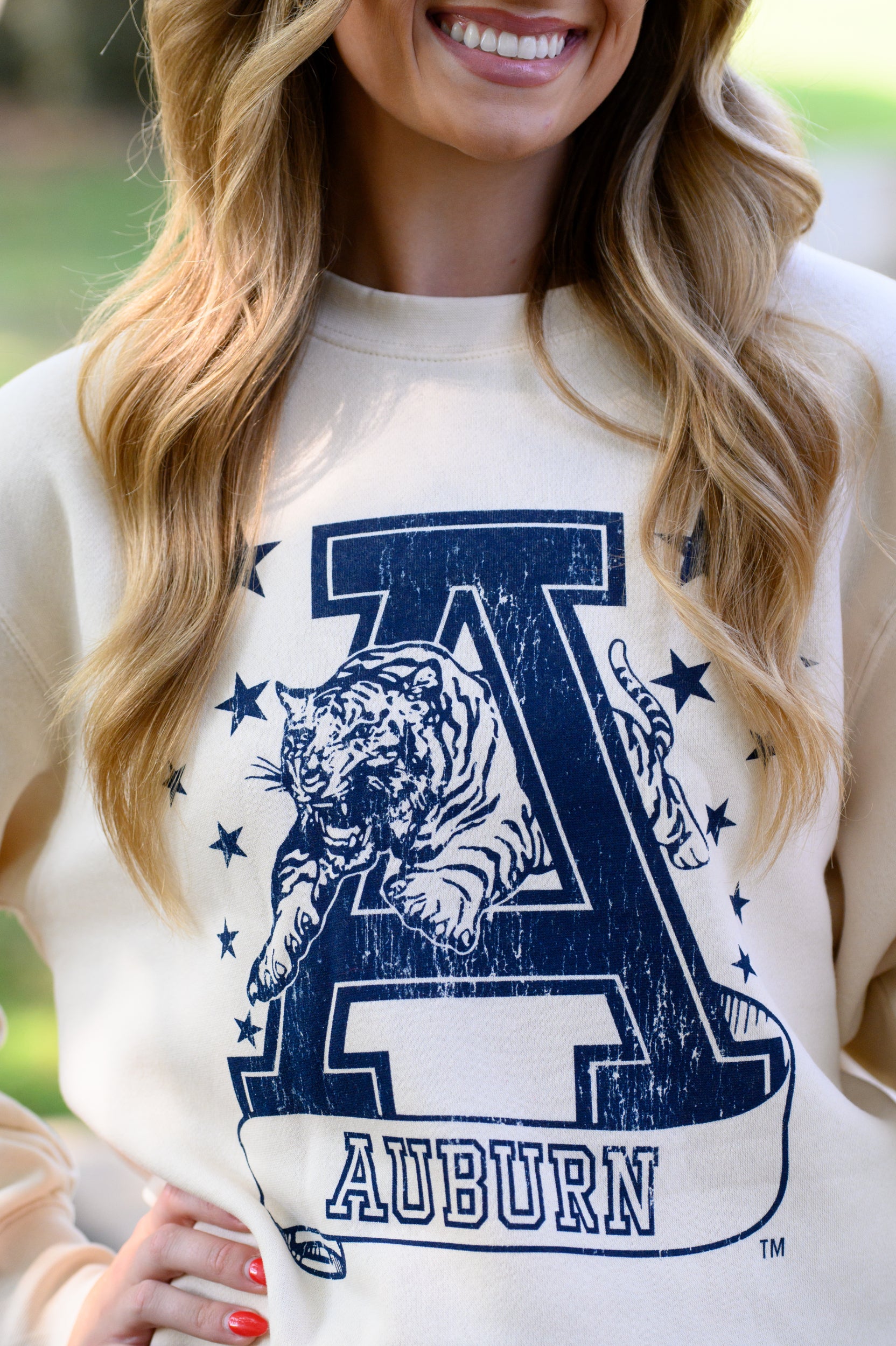 Auburn University Ivory Sweatshirt with Navy stars surrounding a Navy Leaping Tiger Logo