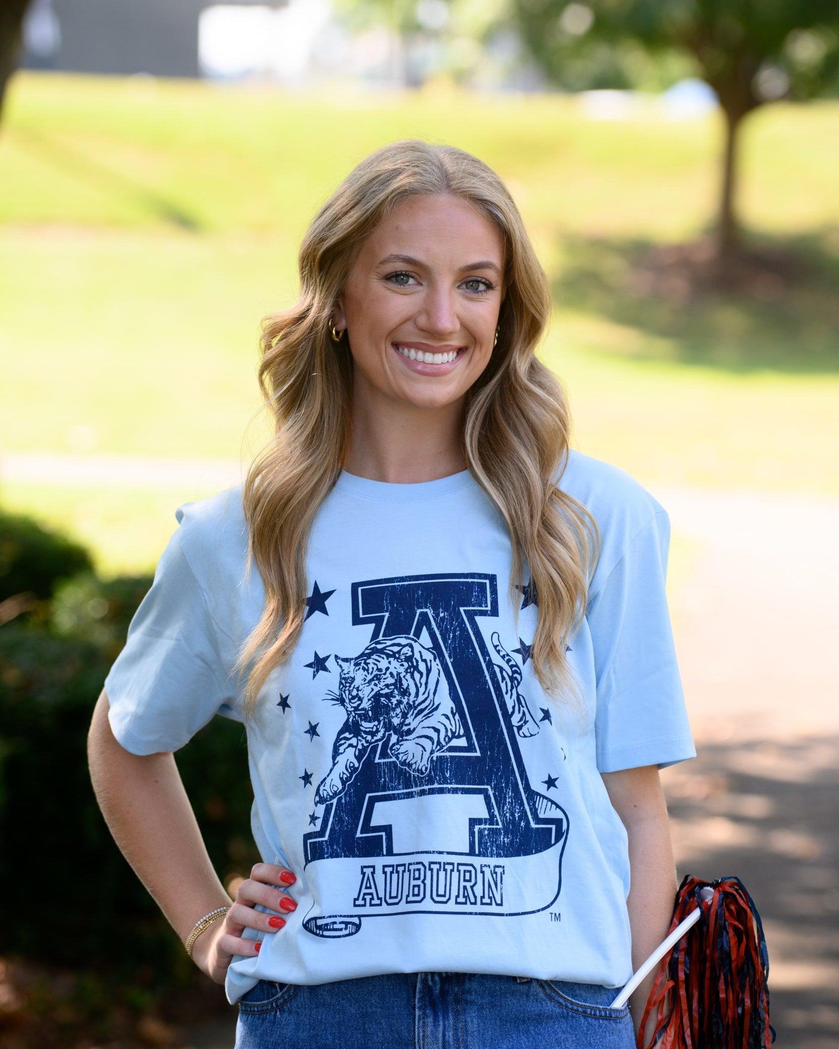 Auburn University Light Blue T-Shirt with Navy stars surrounding a Navy Leaping Tiger Logo