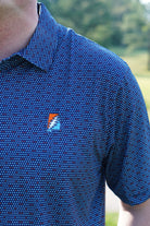 Auburn University AU Team Dot Polo (Grateful State) Navy Men's JNJ Performance Polo  with a pattern of Light Blue and Orange Dots and Embroidered Orange and Blue Grateful State Logo