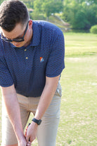 Auburn University AU Team Dot Polo (Grateful State) Navy Men's JNJ Performance Polo  with a pattern of Light Blue and Orange Dots and Embroidered Orange and Blue Grateful State Logo
