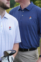 Auburn University AU Team Dot Polo (Grateful State) Navy Men's JNJ Performance Polo  with a pattern of Light Blue and Orange Dots and Embroidered Orange and Blue Grateful State Logo