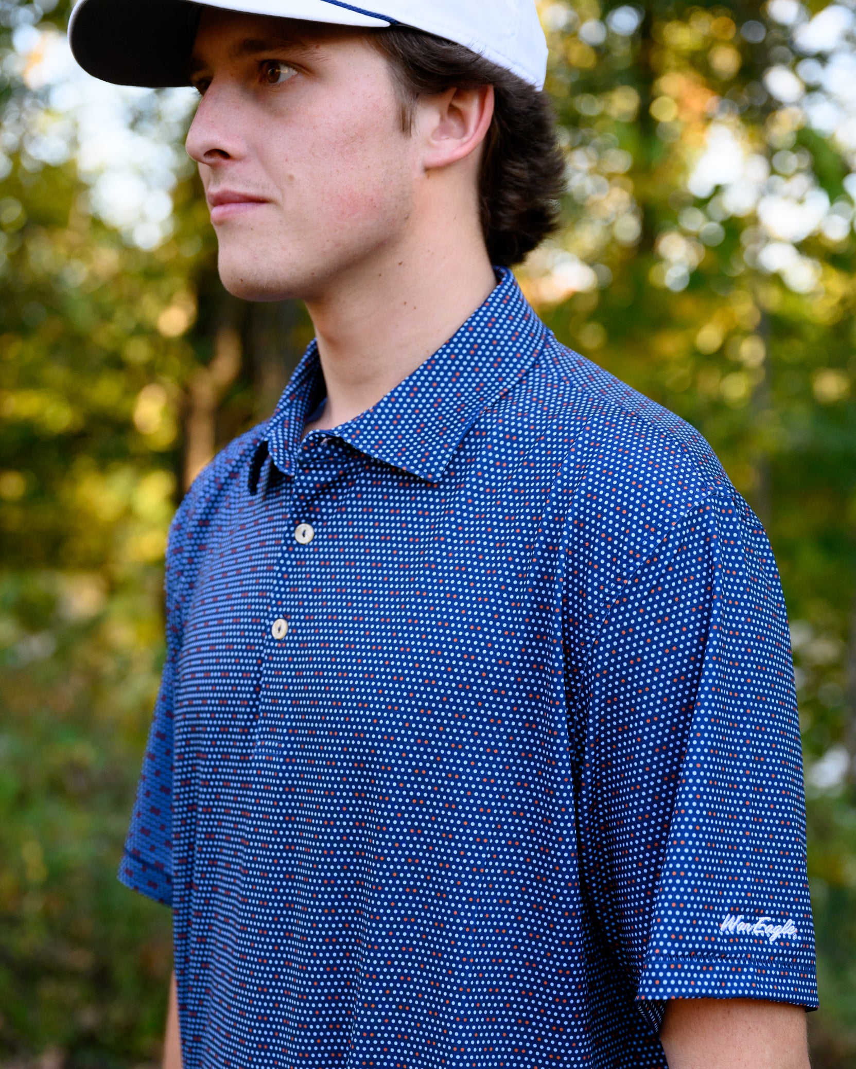 Auburn University Navy Men's Dot Polo with Light Blue and Orange dots and White "War Eagle" embroidery on the sleeve