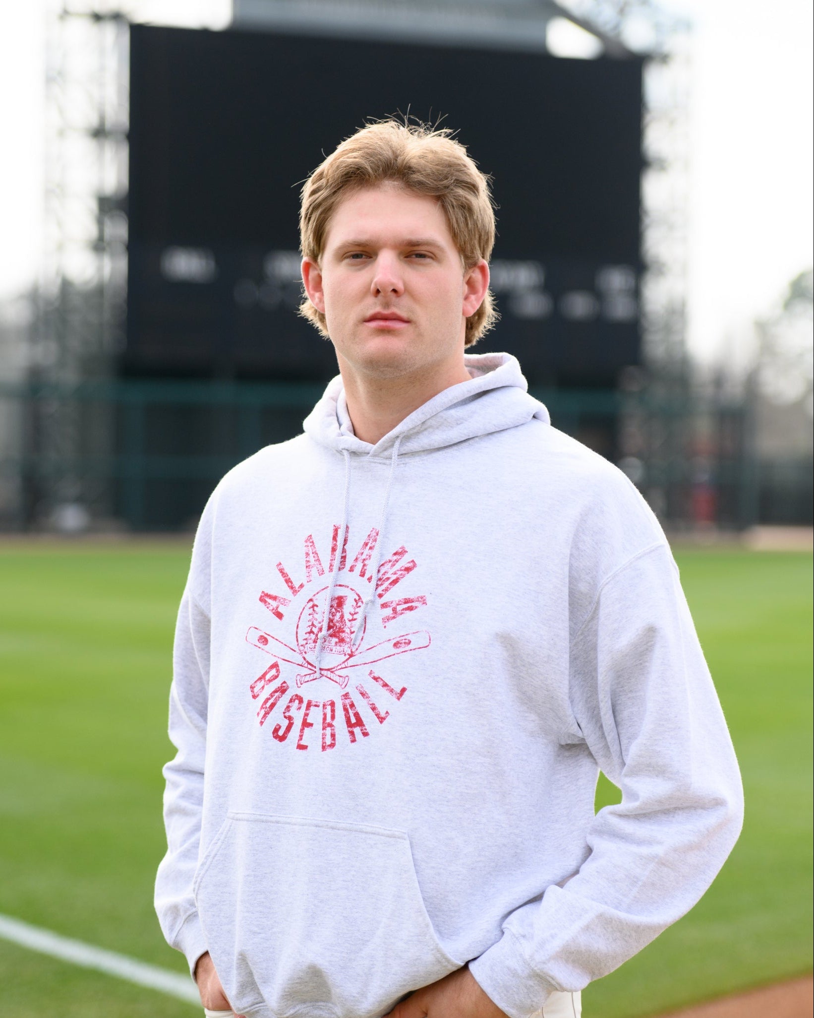 University of Alabama Distressed Light Grey Hoodie with a Red Baseball featuring the Vintage A logo over crossed baseball bats, surrounded by Red text “Alabama Baseball”