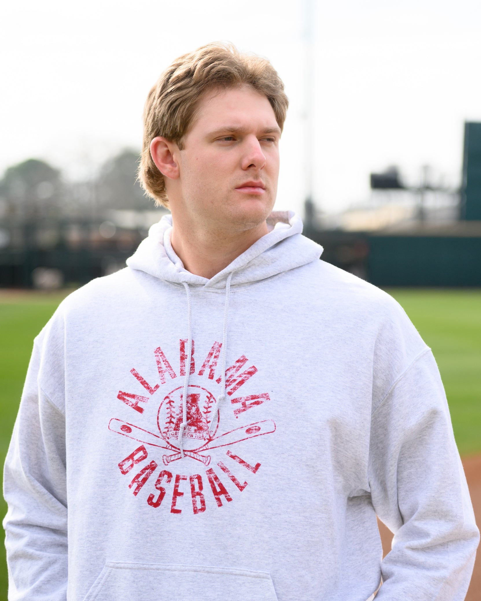 University of Alabama Distressed Light Grey Hoodie with a Red Baseball featuring the Vintage A logo over crossed baseball bats, surrounded by Red text “Alabama Baseball”