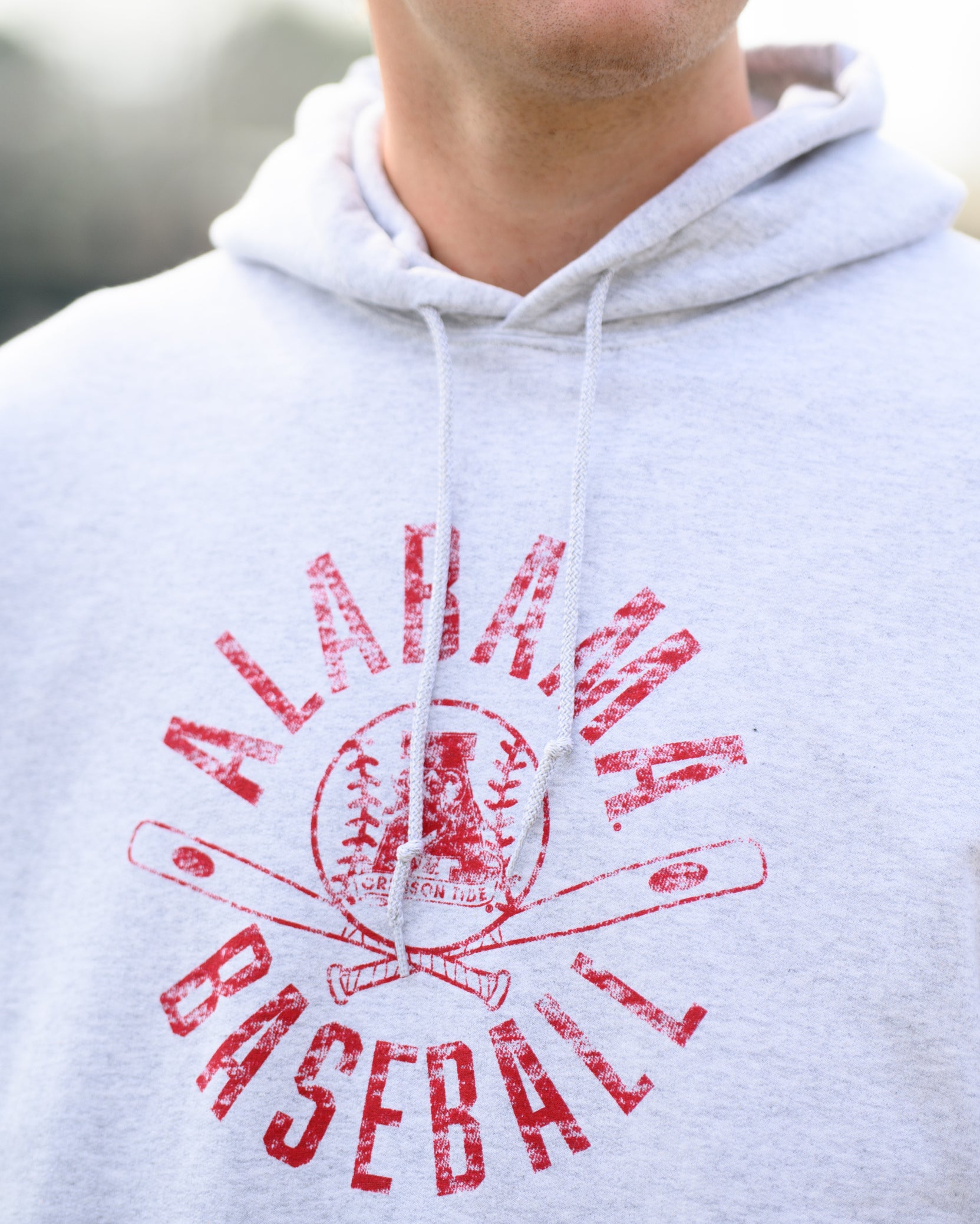 University of Alabama Distressed Light Grey Hoodie with a Red Baseball featuring the Vintage A logo over crossed baseball bats, surrounded by Red text “Alabama Baseball”