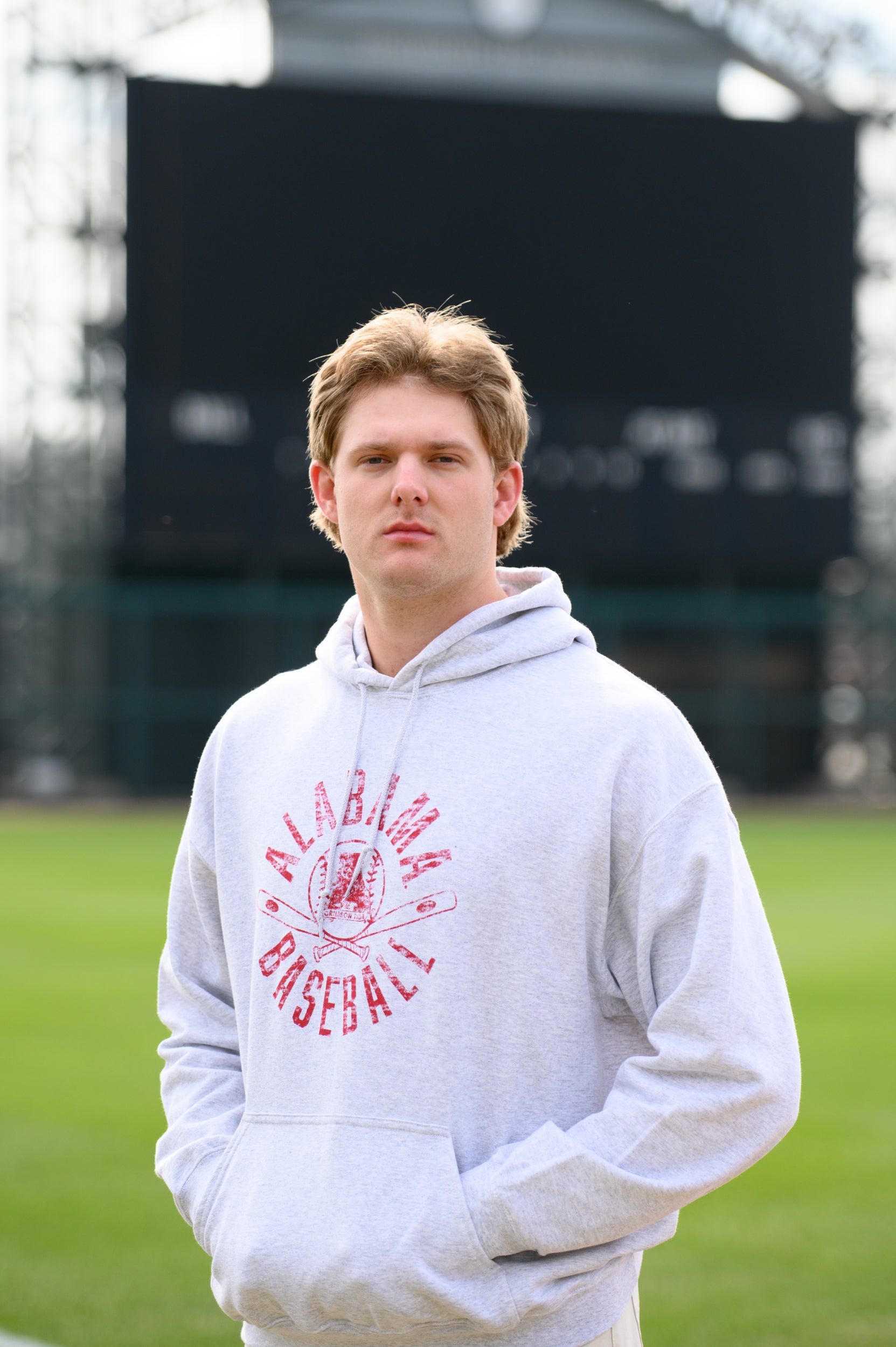 University of Alabama Distressed Light Grey Hoodie with a Red Baseball featuring the Vintage A logo over crossed baseball bats, surrounded by Red text “Alabama Baseball”