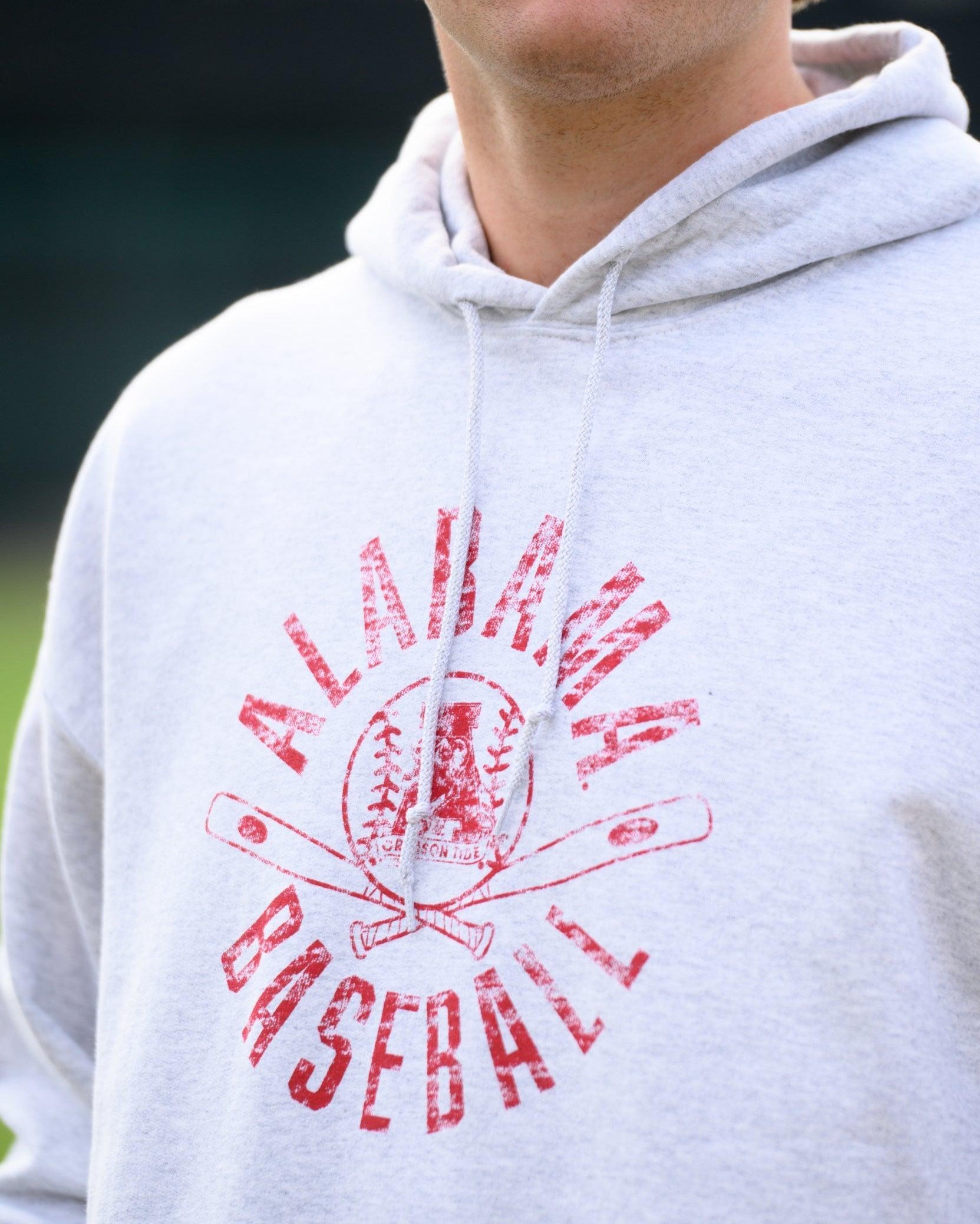 University of Alabama Distressed Light Grey Hoodie with a Red Baseball featuring the Vintage A logo over crossed baseball bats, surrounded by Red text “Alabama Baseball”