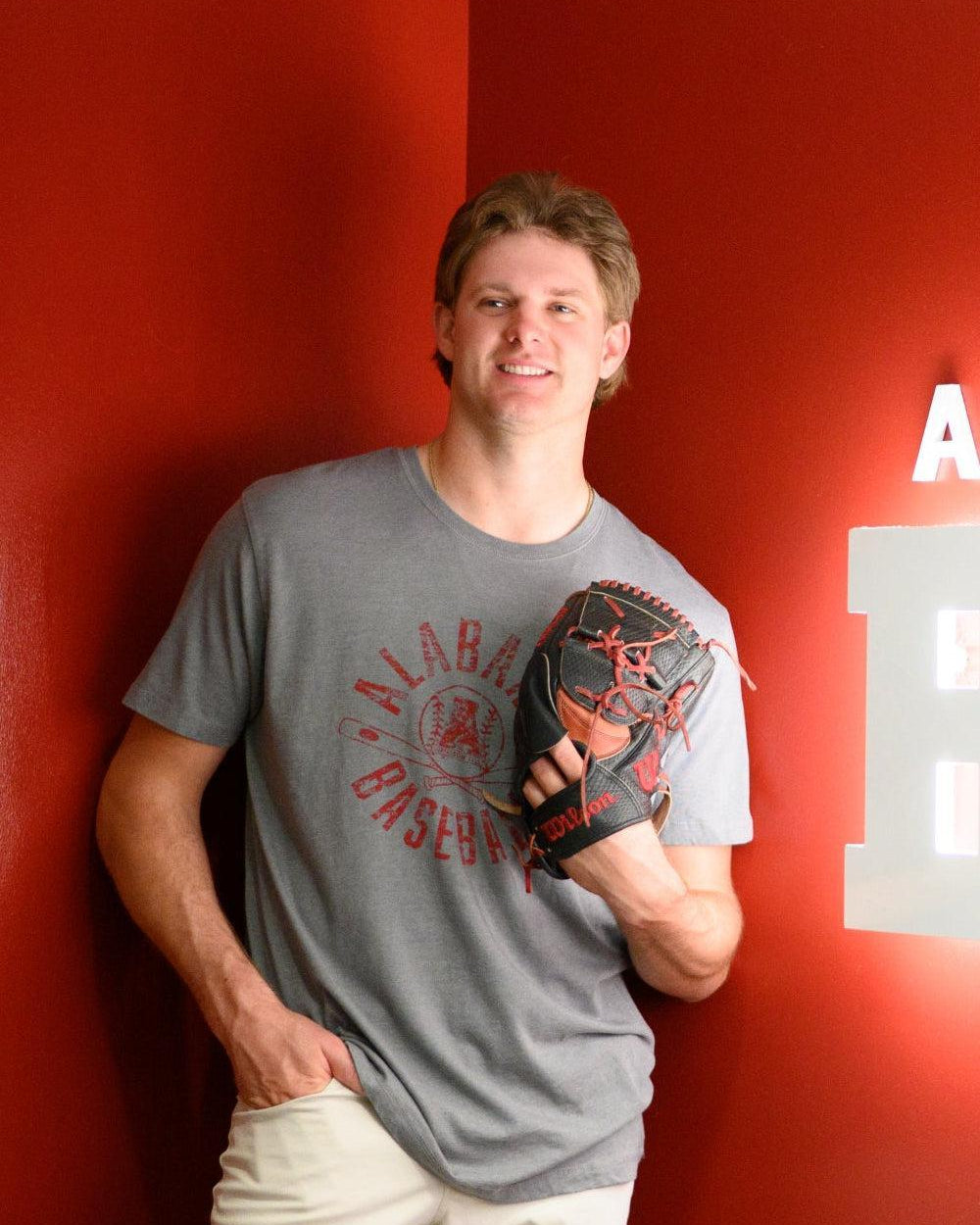 University of Alabama Distressed Grey T-Shirt with a Red Baseball featuring the Vintage A logo over crossed baseball bats, surrounded by White text “Alabama Baseball”