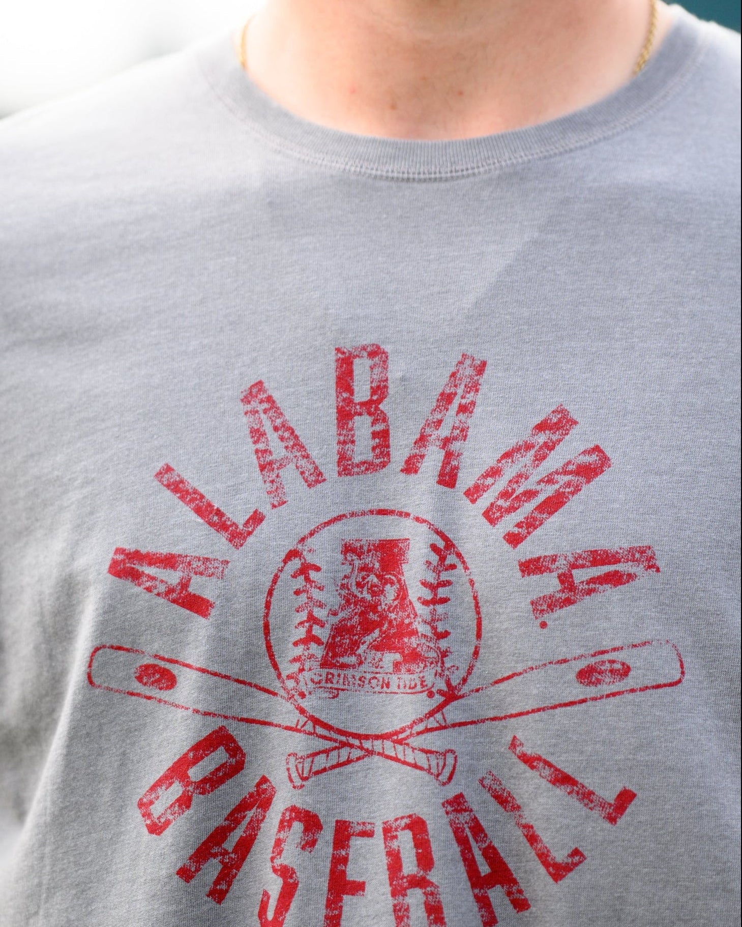 University of Alabama Distressed Grey T-Shirt with a Red Baseball featuring the Vintage A logo over crossed baseball bats, surrounded by White text “Alabama Baseball”