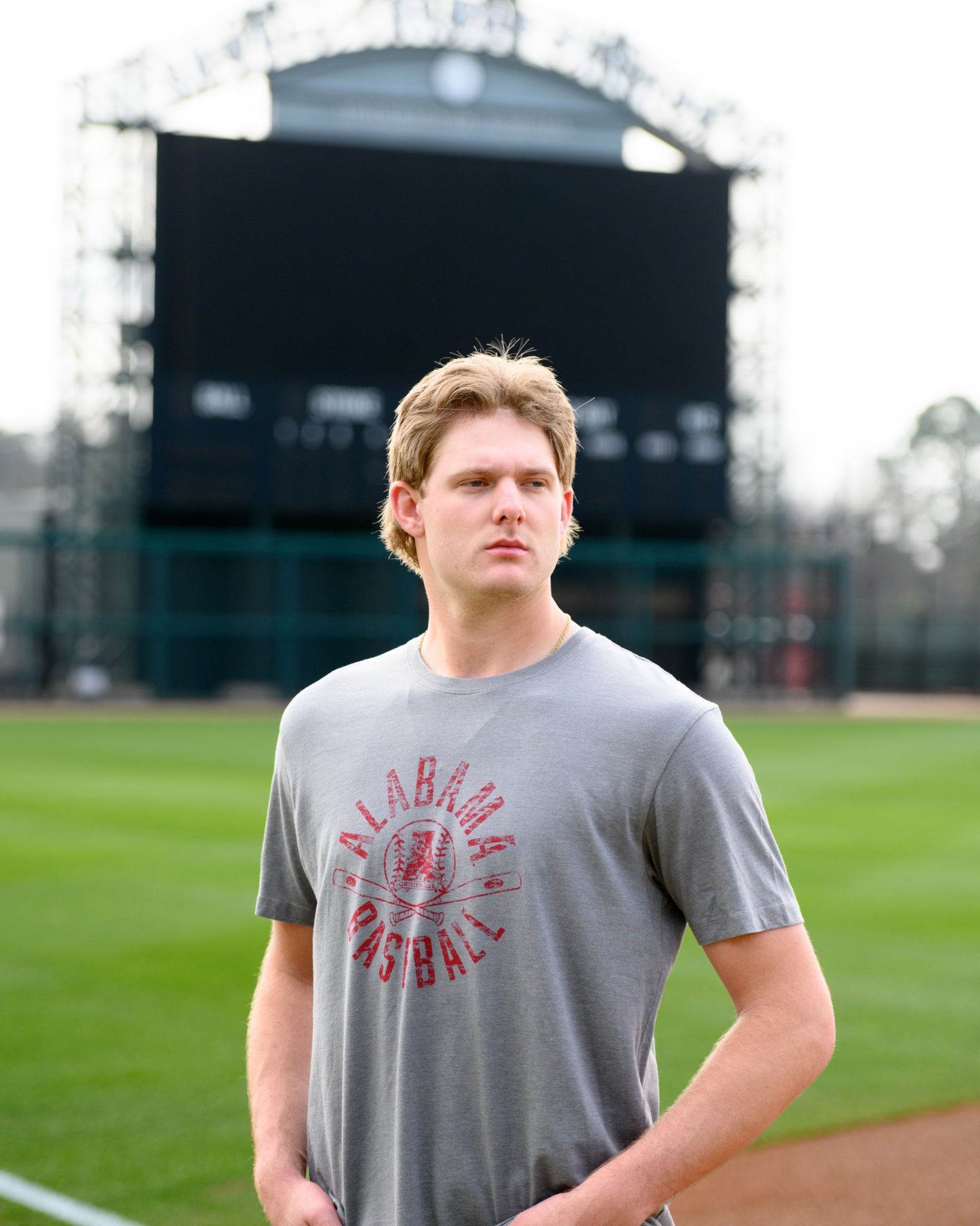 University of Alabama Distressed Grey T-Shirt with a Red Baseball featuring the Vintage A logo over crossed baseball bats, surrounded by White text “Alabama Baseball”