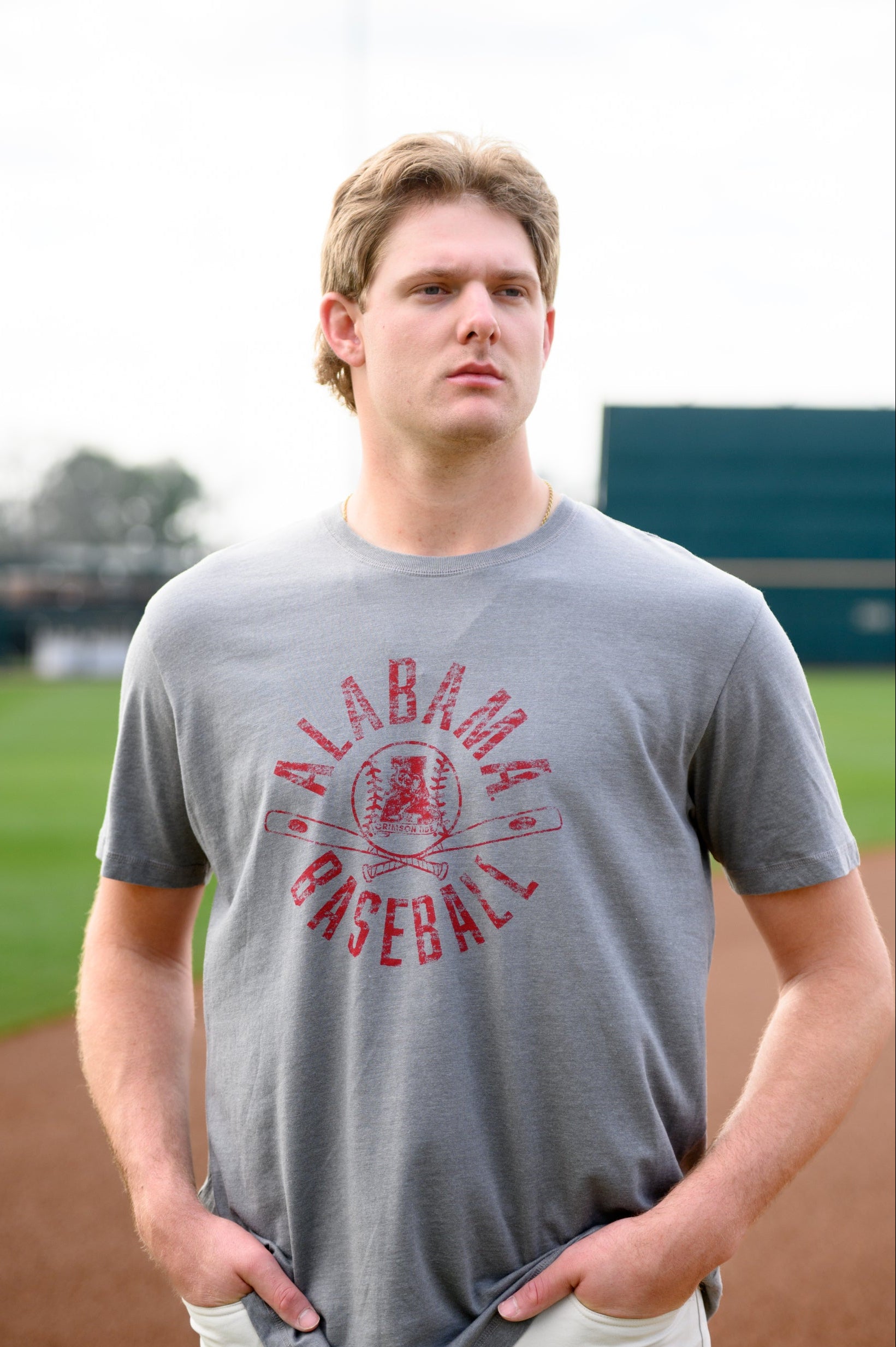 University of Alabama Distressed Grey T-Shirt with a Red Baseball featuring the Vintage A logo over crossed baseball bats, surrounded by White text “Alabama Baseball”