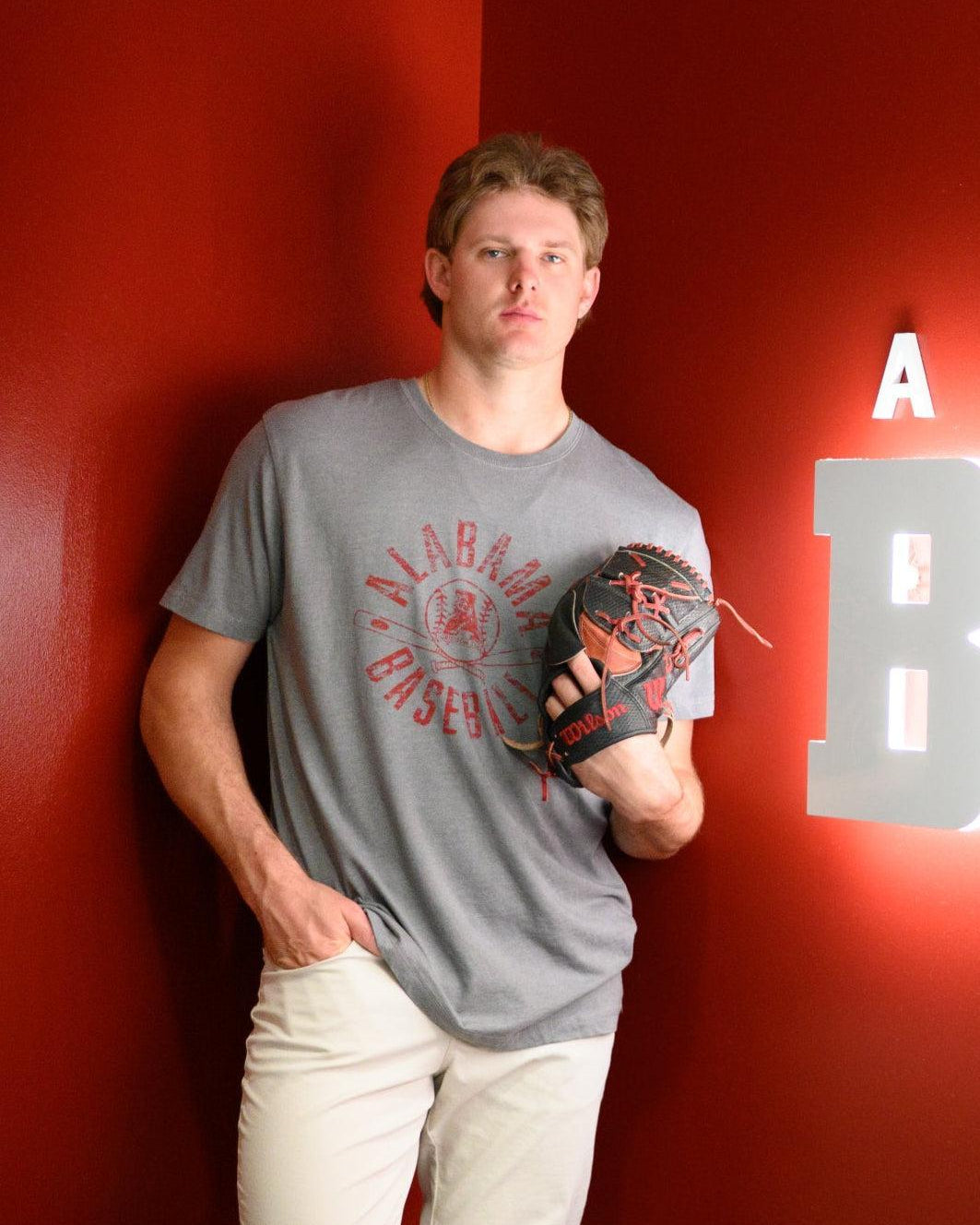 University of Alabama Distressed Grey T-Shirt with a Red Baseball featuring the Vintage A logo over crossed baseball bats, surrounded by White text “Alabama Baseball”