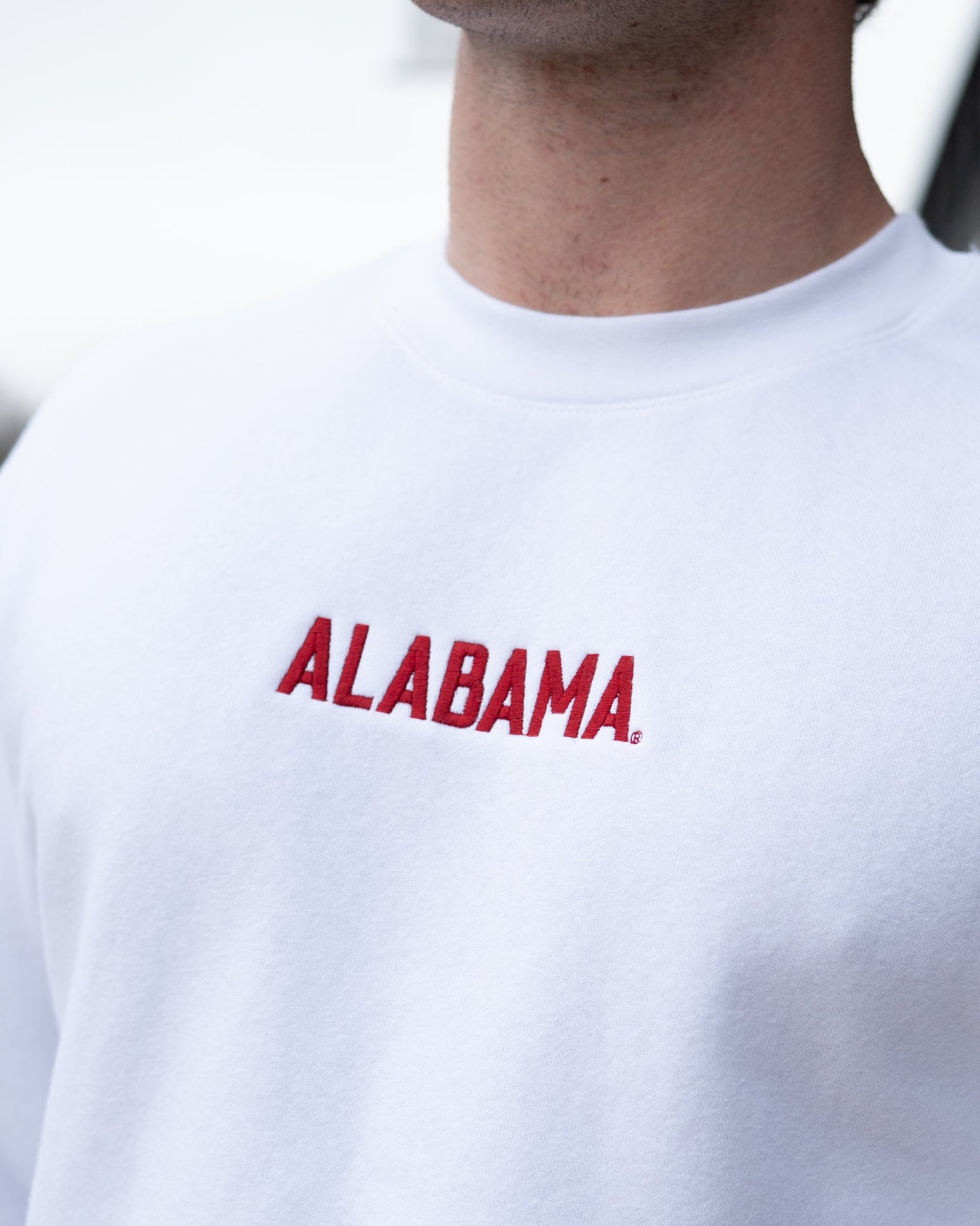 University of Alabama White American Apparel Sweatshirt with 'ALABAMA' embroidered on the front in red letters.