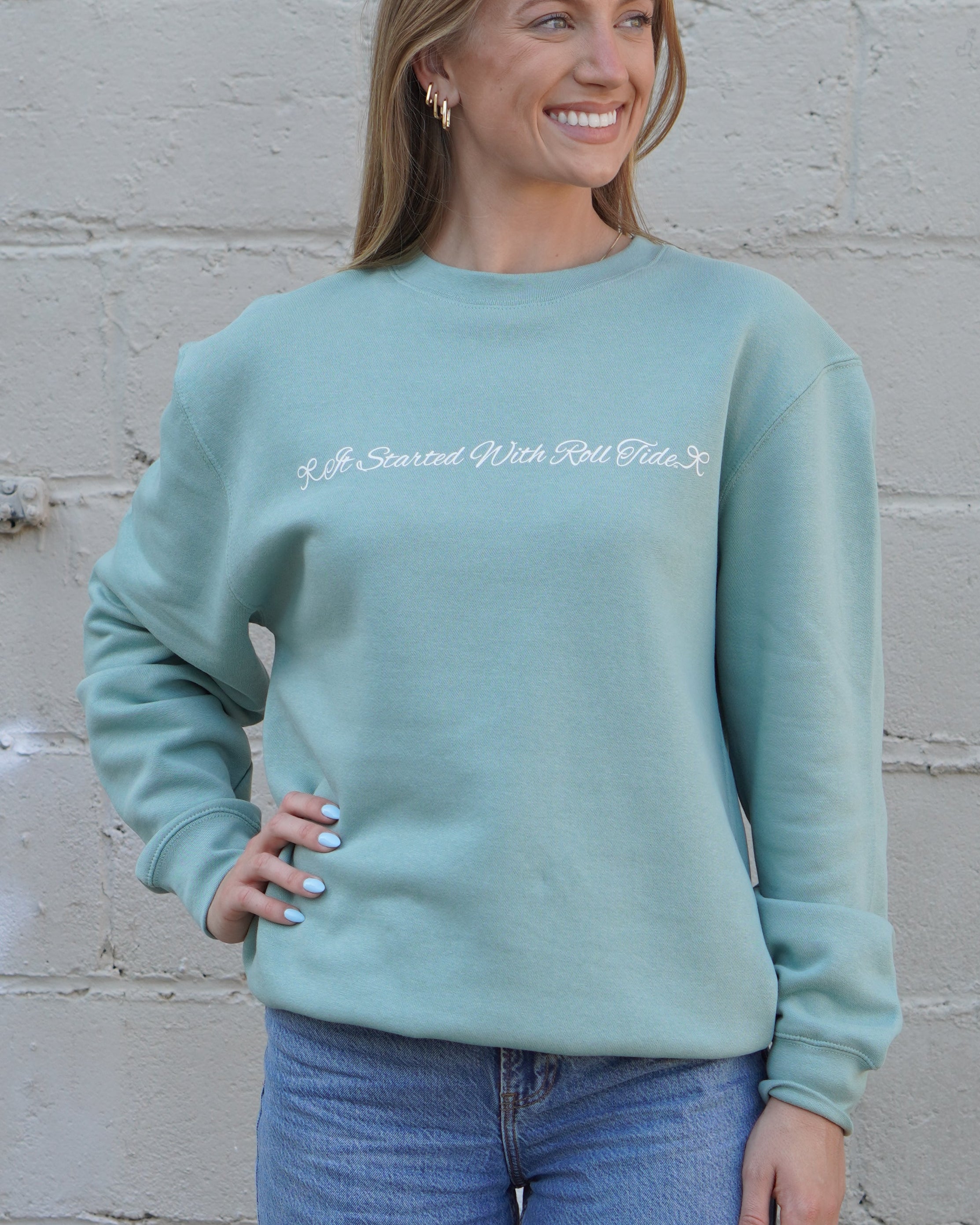 University of Alabama Seafoam Crewneck with cursive writing on the front and an open locket with the writing “Bama” inside on the back