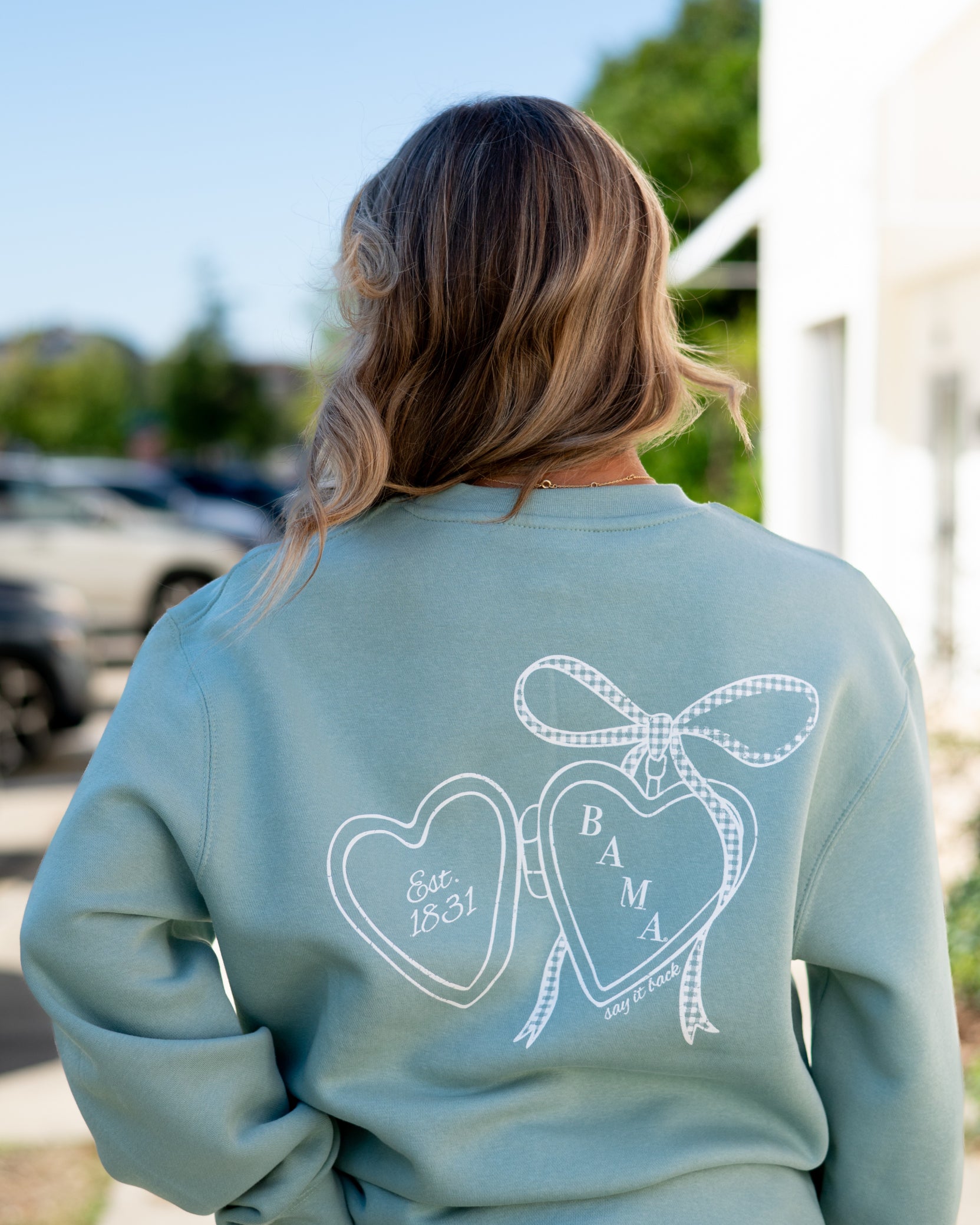University of Alabama Seafoam Crewneck with cursive writing on the front and an open locket with the writing “Bama” inside on the back