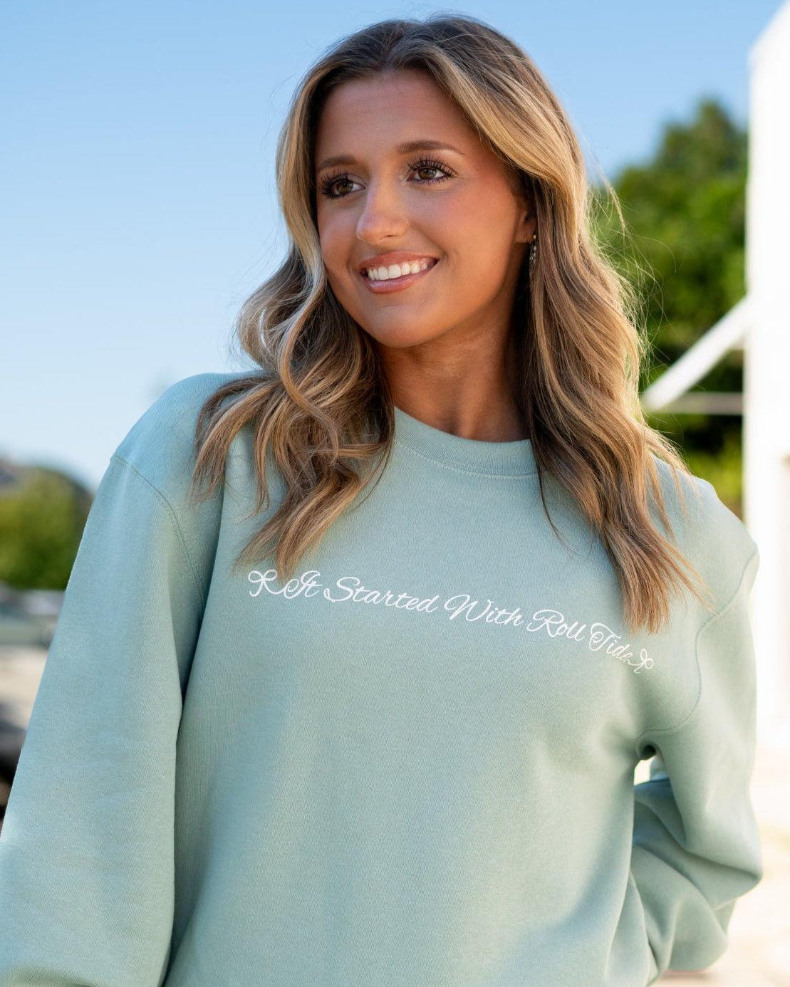 University of Alabama Seafoam Crewneck with cursive writing on the front and an open locket with the writing “Bama” inside on the back