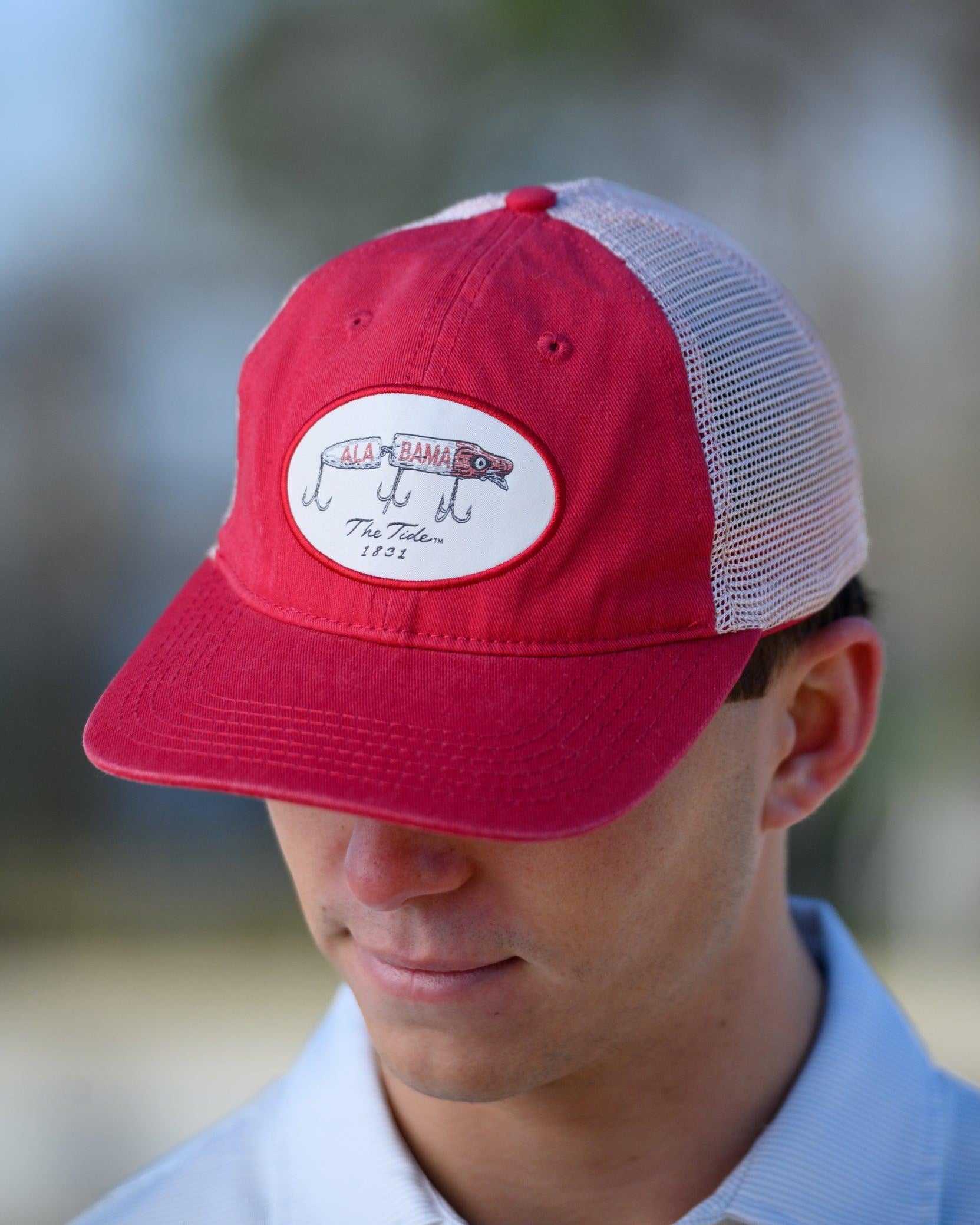 University of Alabama Red Trucker Hat featuring a patch with an image of a fishing lure with Red text "Alabama"