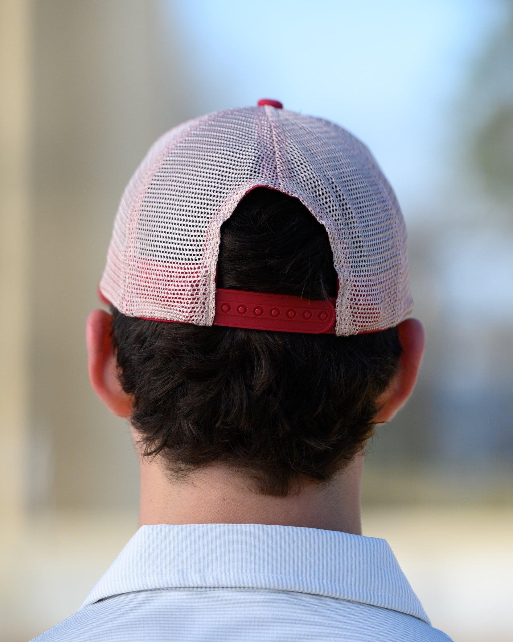 University of Alabama Red Trucker Hat featuring a patch with an image of a fishing lure with Red text "Alabama."
Snapback Trucker