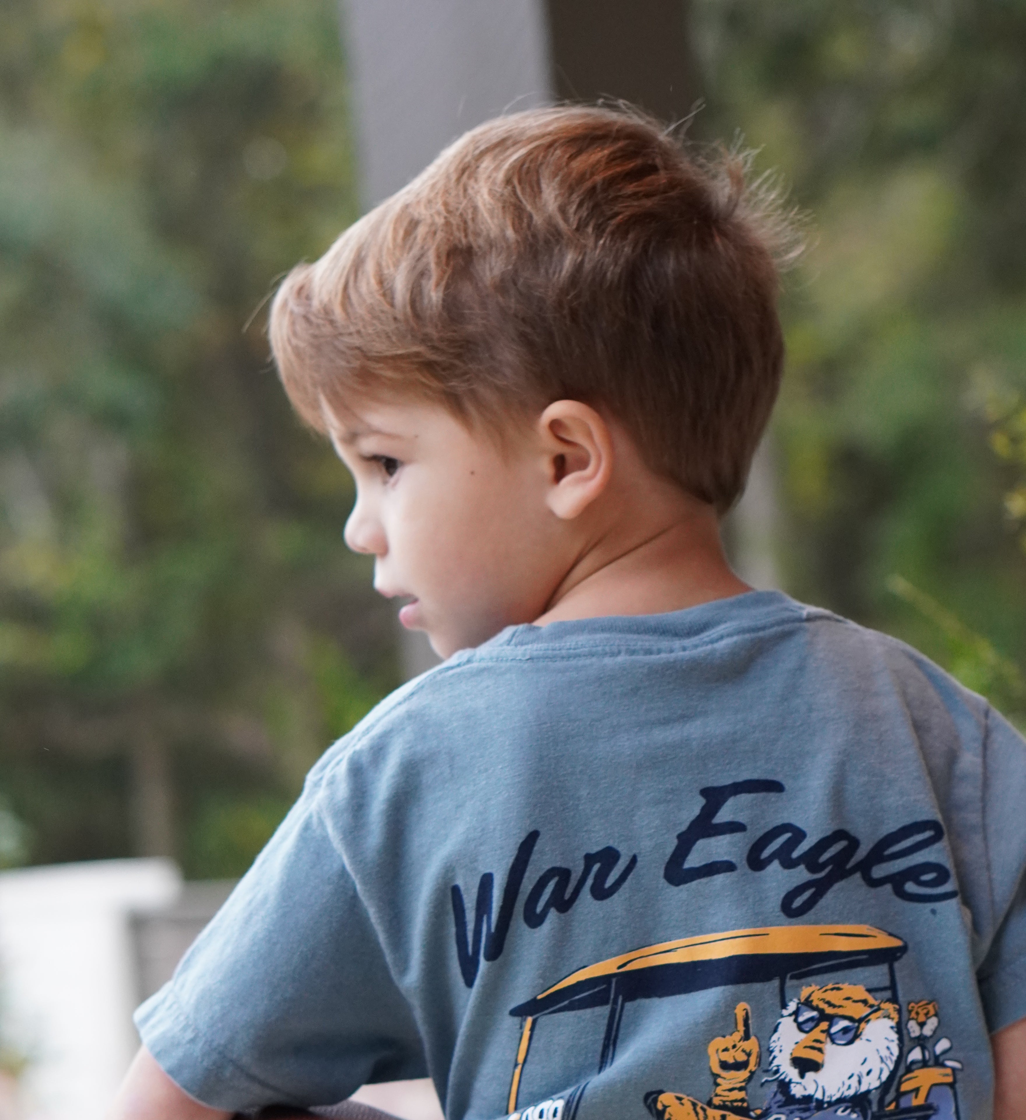 Auburn University Aubie Golf Cart Ice Blue Comfort Colors T-Shirt  with the text "War Eagle" above an image of Aubie the Tiger wearing sunglasses and driving a golf cart