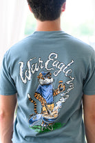 Auburn University Blue T-Shirt with a drawing of Aubie grilling and the words “War Eagle” written in the smoke