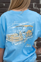 Auburn University  Aubie Pontoon Azure Comfort Colors T-Shirt with an image of Aubie the Tiger lounging on the side of an Orange and White Pontoon Boat  with the text "USS WAR EAGLE" below