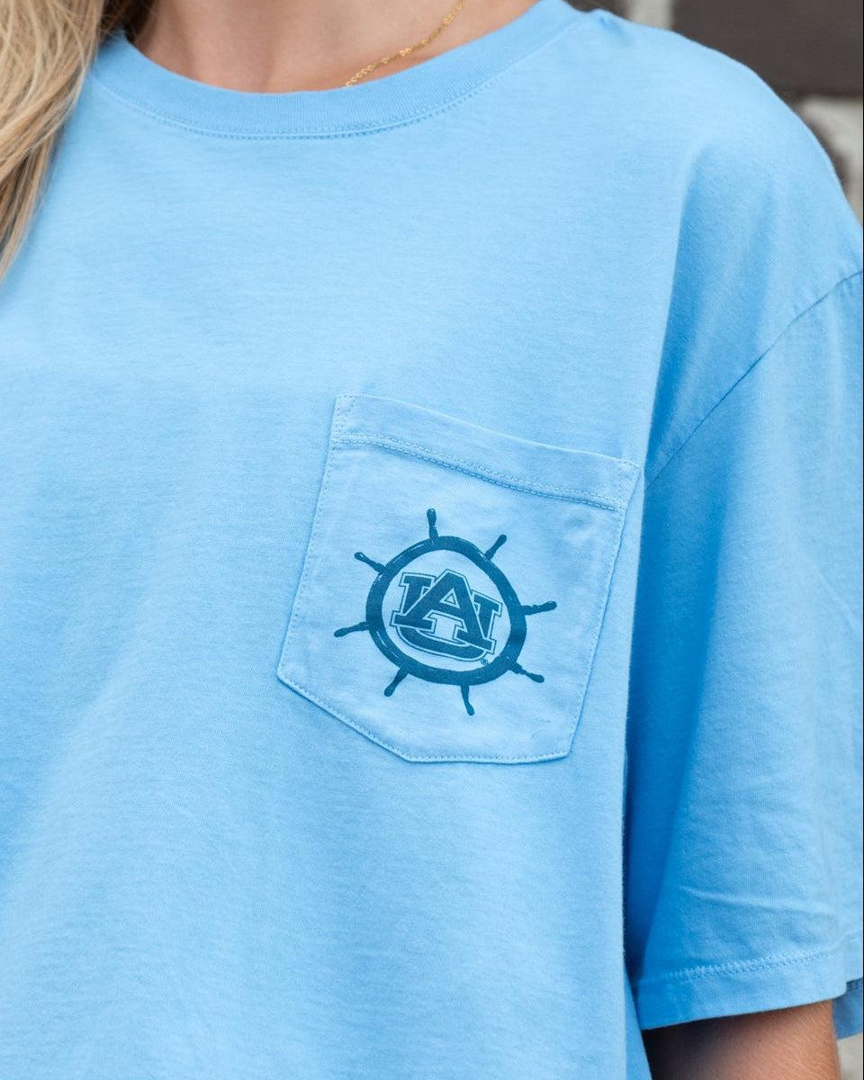 Auburn University Blue Shirt with a Front Pocket featuring a ships wheel circling the classic AU Logo