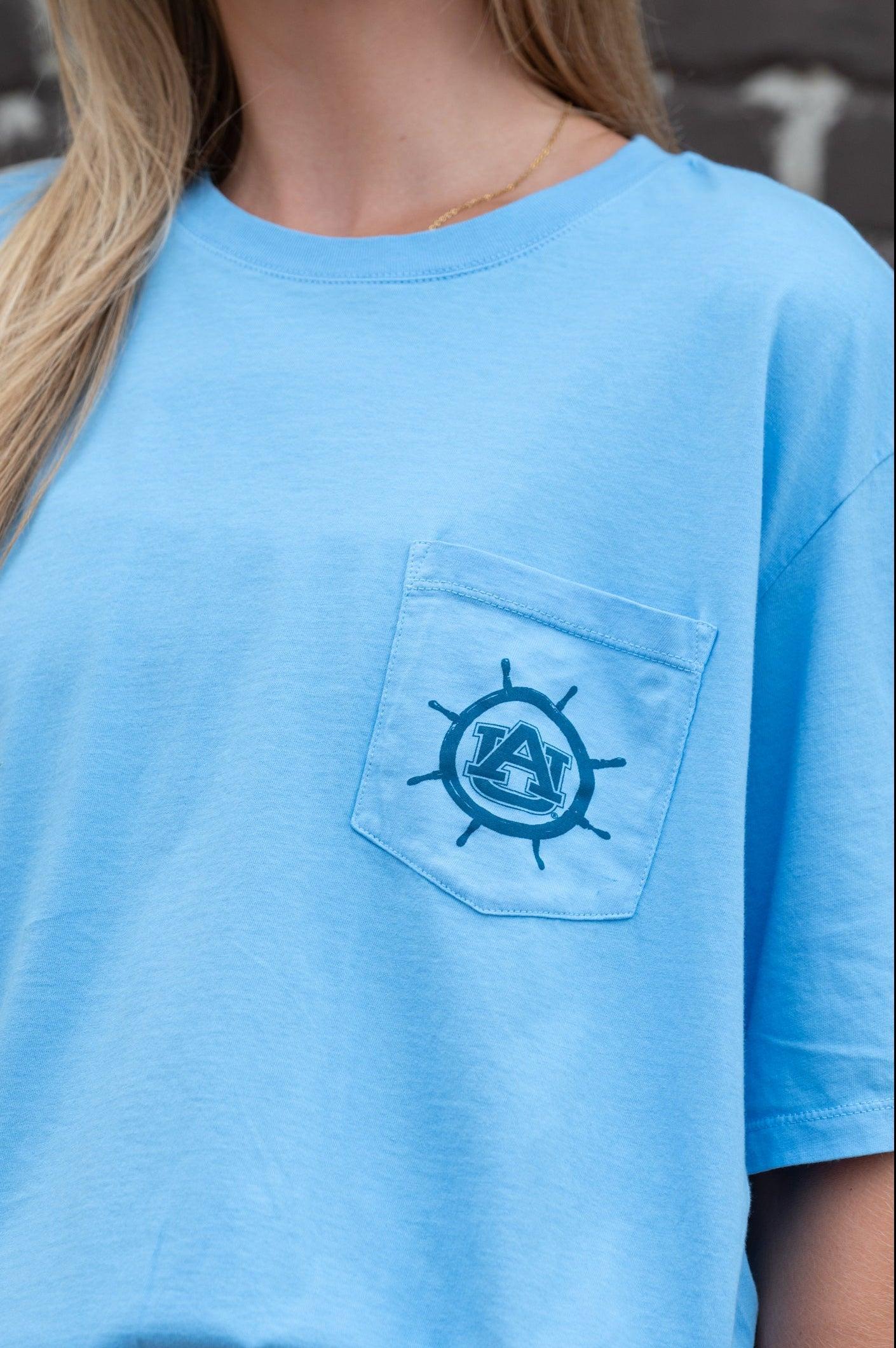 Auburn University Blue Shirt with a Front Pocket featuring a ships wheel circling the classic AU Logo