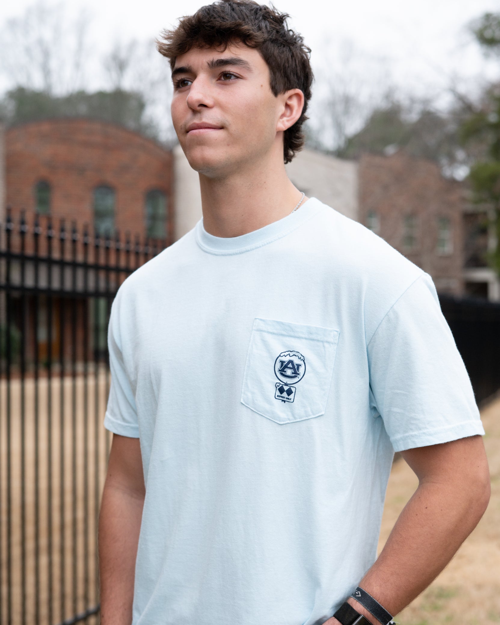 Auburn University Light Blue T-Shirt with a snow-covered Classic AU Logo on the front pocket