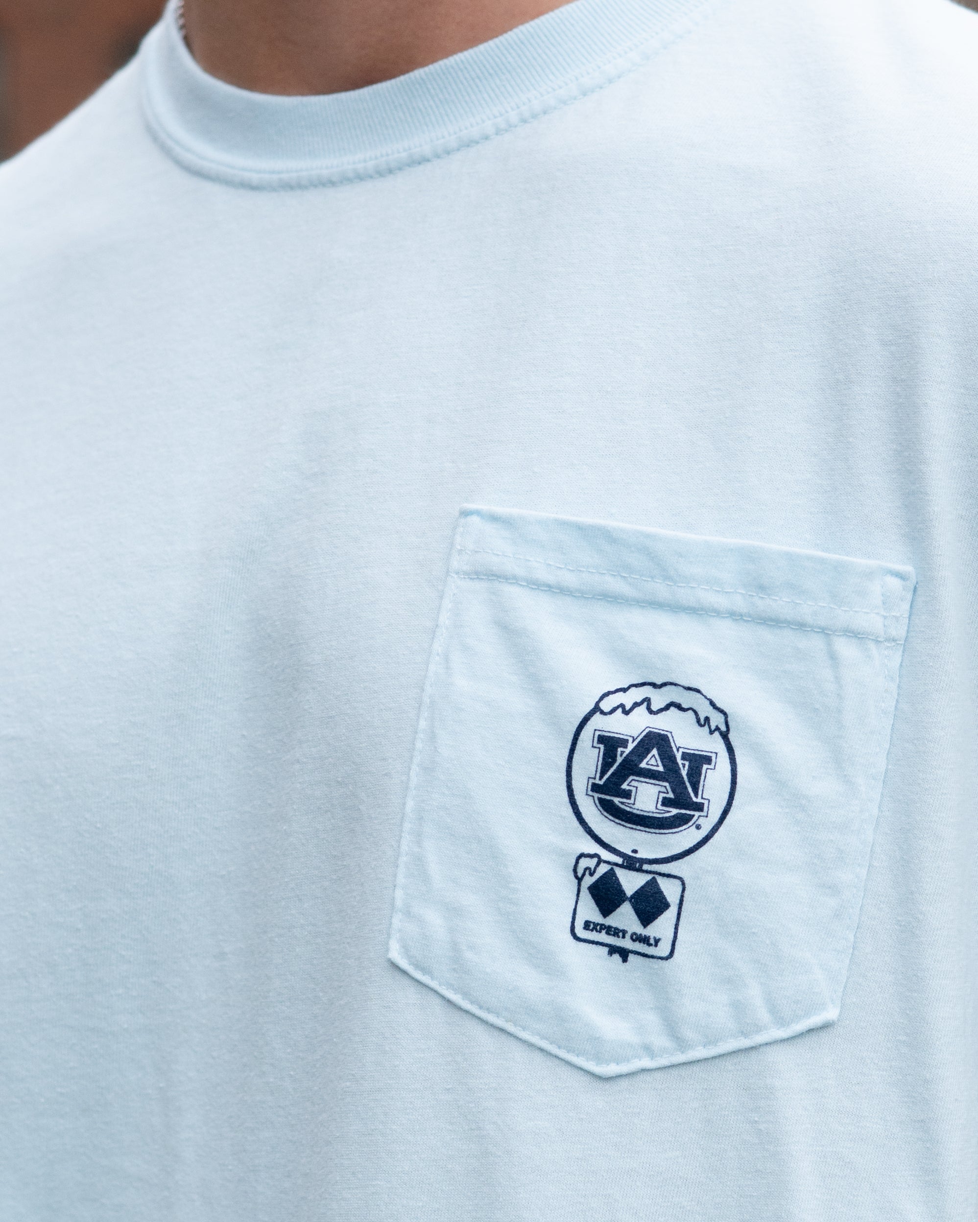 Auburn University Light Blue T-Shirt with a snow-covered Classic AU Logo on the front pocket