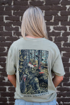 Auburn University Aubie Turkey Call Comfort Colors Bay with an image of Aubie the Tiger wearing hunting gear and sitting next to turkeys