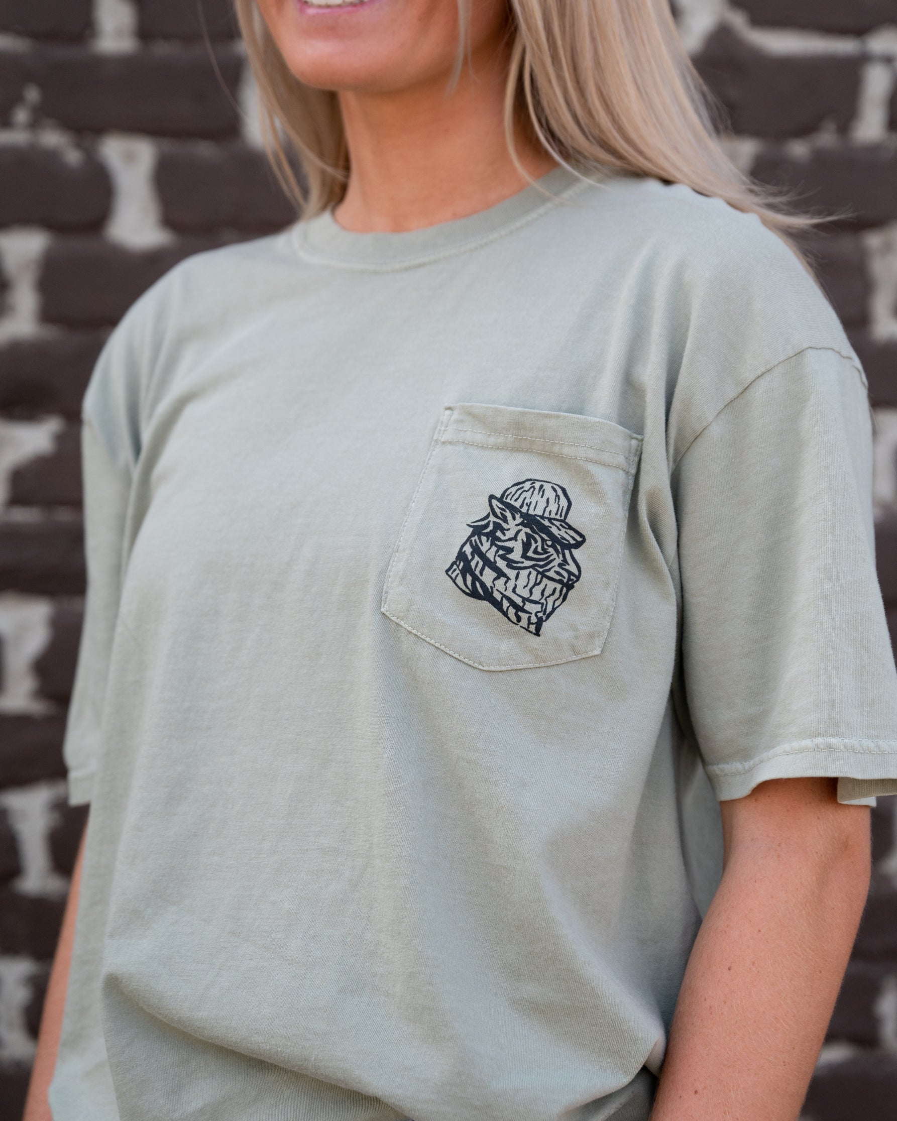 Auburn University Aubie Turkey Call Comfort Colors Sandstone with an image of Aubie the Tiger wearing hunting gear and sitting next to turkeys