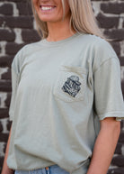 Auburn University Aubie Turkey Call Comfort Colors Sandstone with an image of Aubie the Tiger wearing hunting gear and sitting next to turkeys