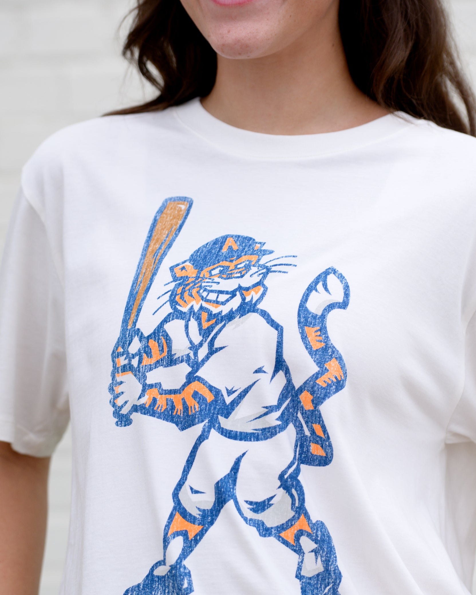 Auburn University Aubie Vintage Baseball Ivory  SoftShirts T-Shirt with an image of a vintage Aubie in a baseball uniform holding a baseball bat