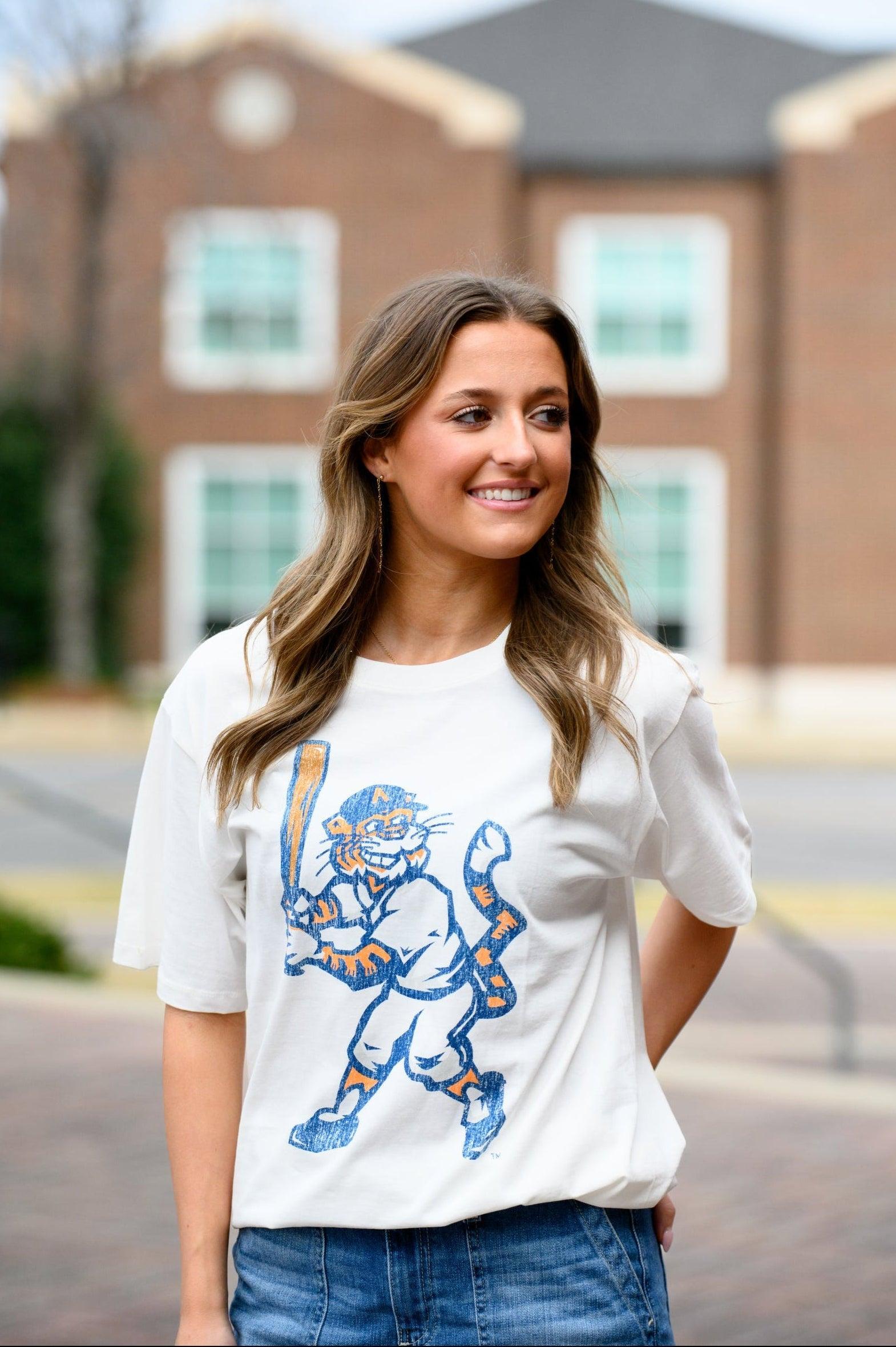Auburn University Aubie Vintage Baseball Ivory SoftShirts T-Shirt with an image of a vintage Aubie in a baseball uniform holding a baseball bat