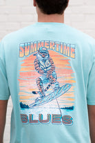 Auburn University Light Blue T-Shirt with an image of Aubie wakeboarding in between text “Summertime Blues”