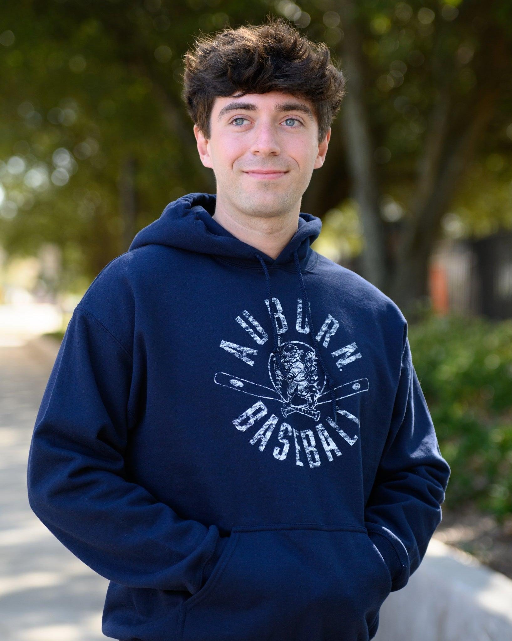 Auburn University Distressed Navy Hoodie with a White Baseball featuring the Original Aubie Baseball logo over crossed baseball bats, surrounded by White text “Auburn Baseball”