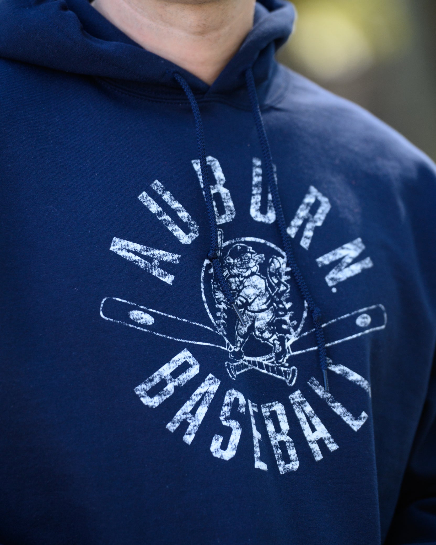 Auburn University Distressed Navy Hoodie with a White Baseball featuring the Original Aubie Baseball logo over crossed baseball bats, surrounded by White text “Auburn Baseball”