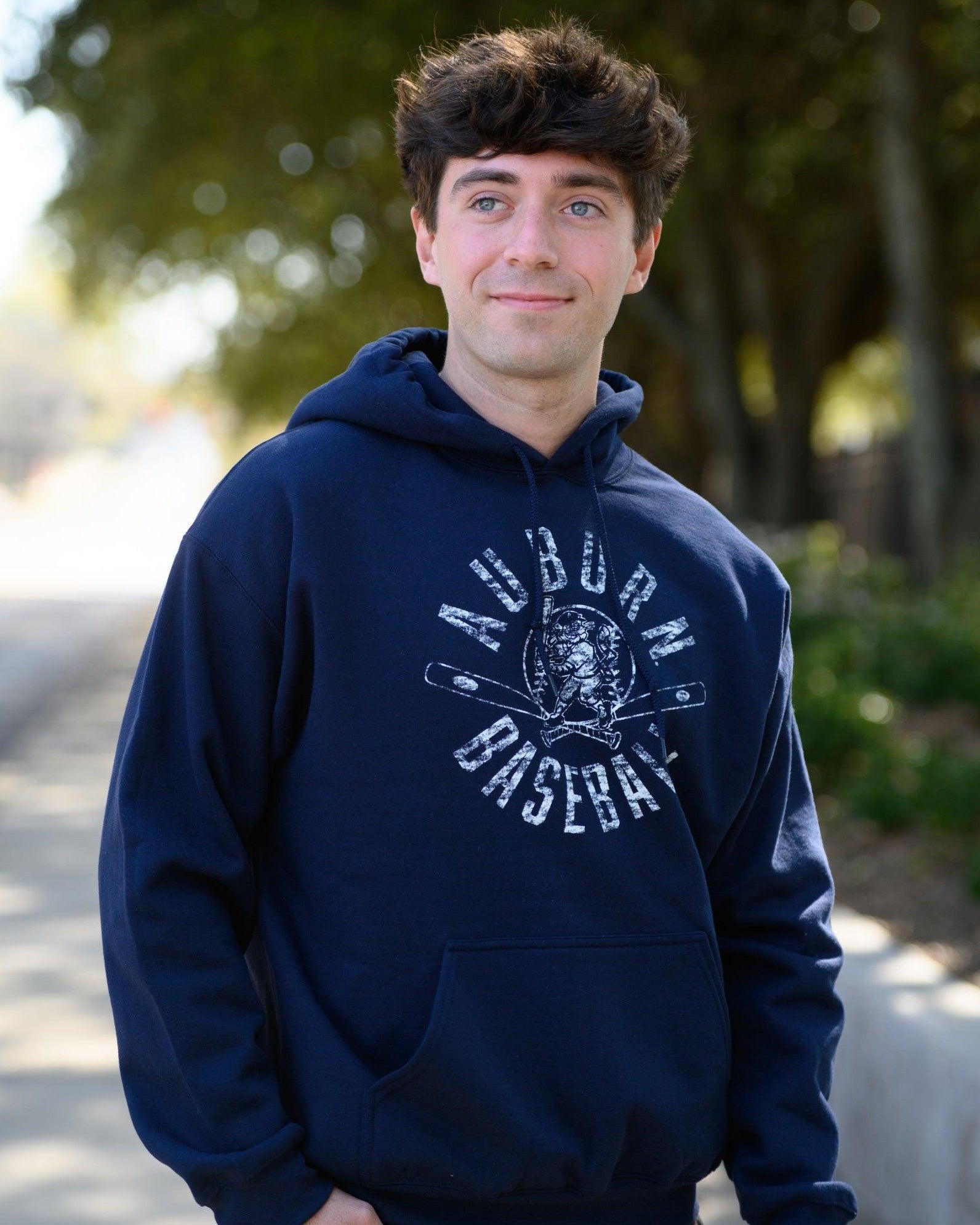 Auburn University Distressed Navy Hoodie with a White Baseball featuring the Original Aubie Baseball logo over crossed baseball bats, surrounded by White text “Auburn Baseball”