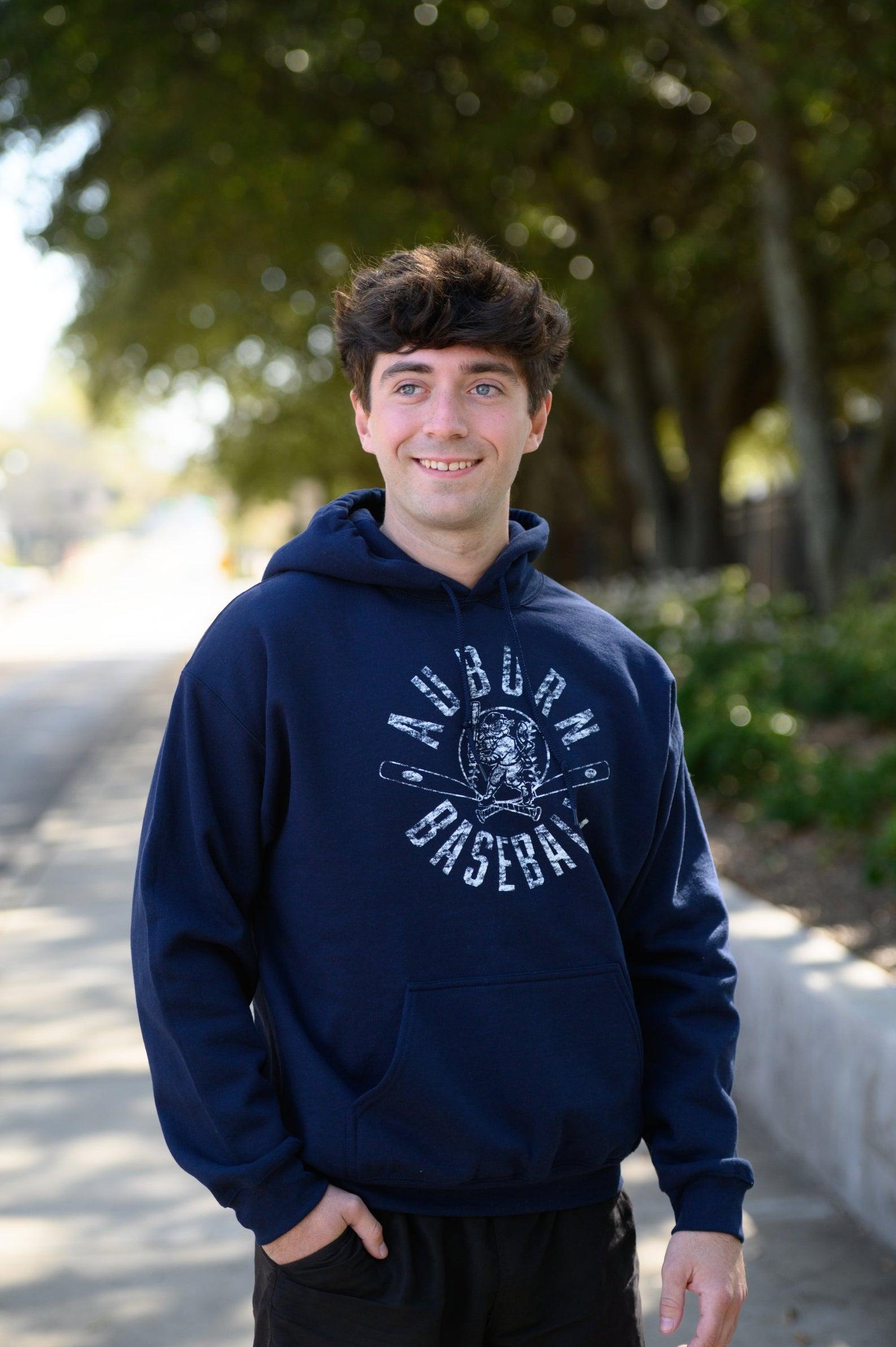 Auburn University Distressed Navy Hoodie with a White Baseball featuring the Original Aubie Baseball logo over crossed baseball bats, surrounded by White text “Auburn Baseball”