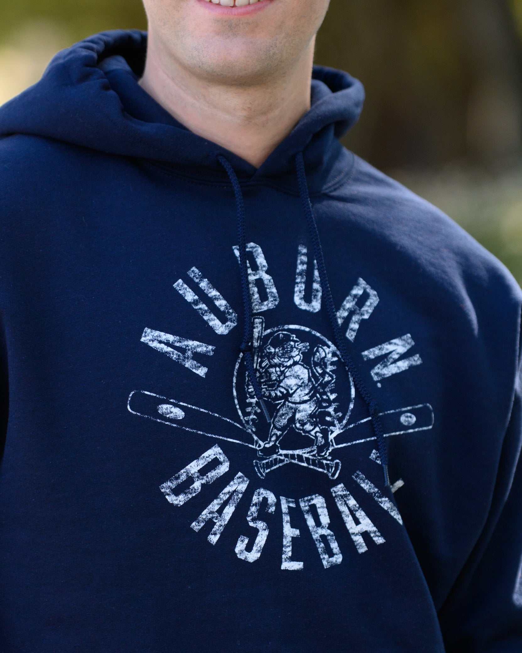 Auburn University Distressed Navy Hoodie with a White Baseball featuring the Original Aubie Baseball logo over crossed baseball bats, surrounded by White text “Auburn Baseball”