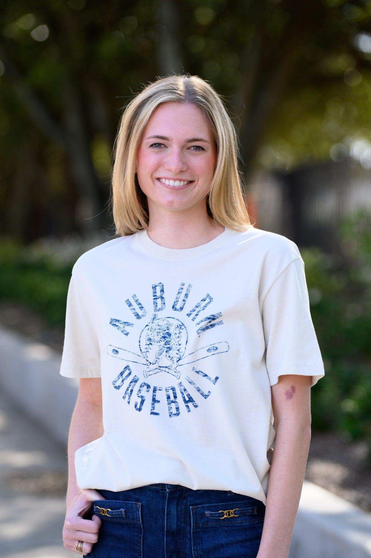 Auburn University Distressed Ivory with a Blue Baseball featuring the Original Aubie Baseball logo over crossed baseball bats, surrounded by Blue text “Auburn Baseball”