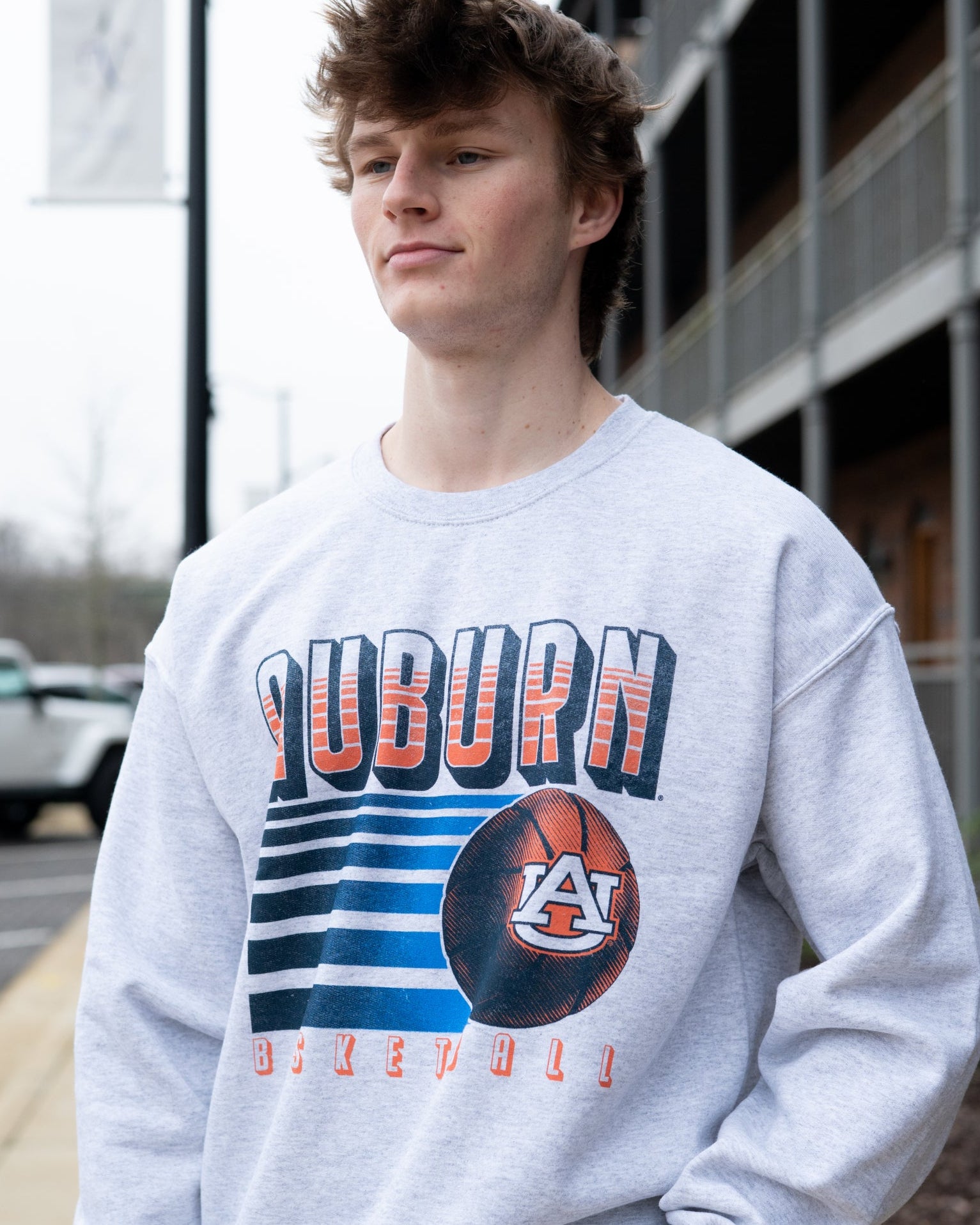 Auburn University Auburn Basketball Vintage White Gildan Sweatshirt with retro style Orange text "Auburn" and an image of a basketball with the AU Logo