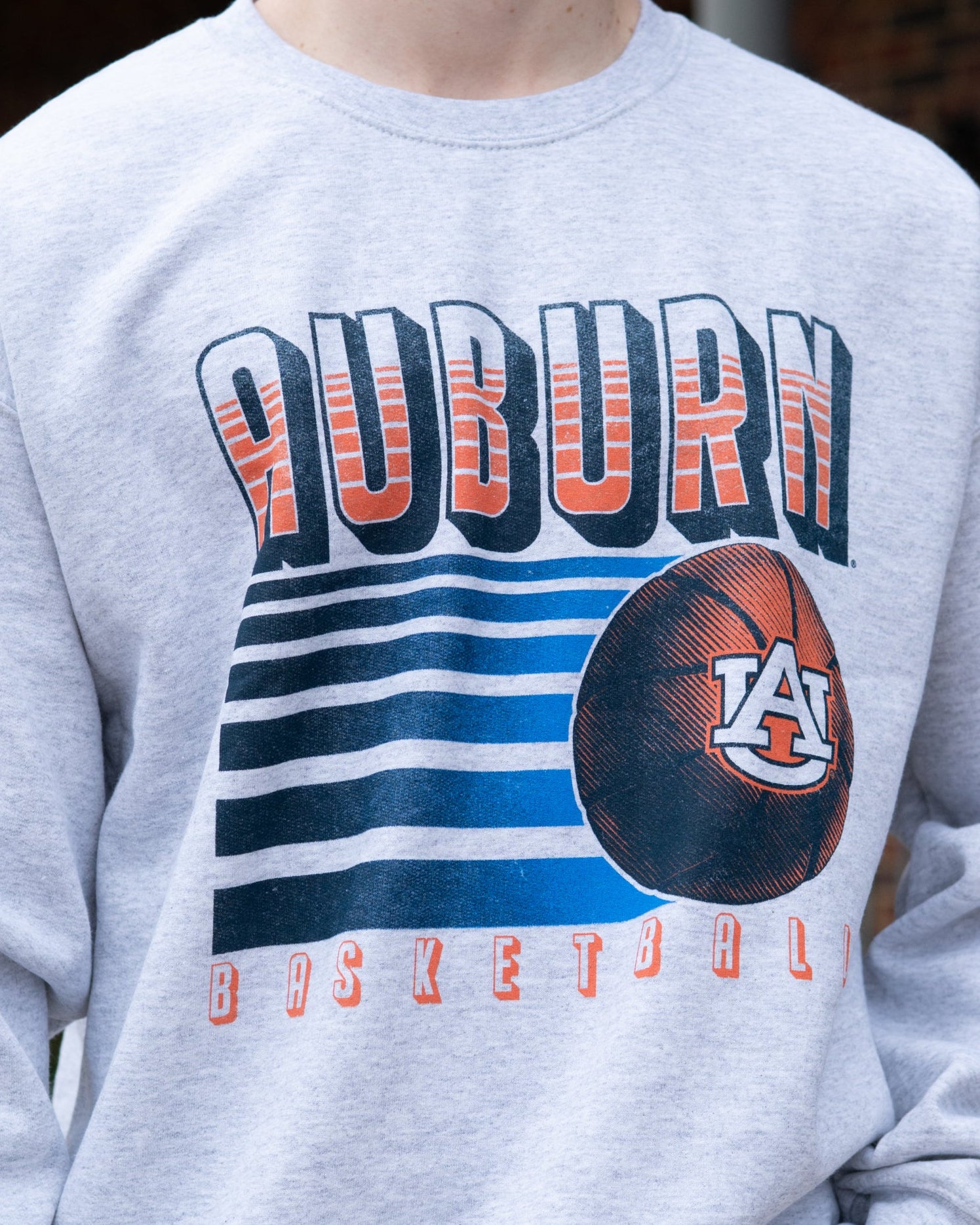 Auburn University Auburn Basketball Vintage White Gildan Sweatshirt with retro style Orange text "Auburn" and an image of a basketball with the AU Logo