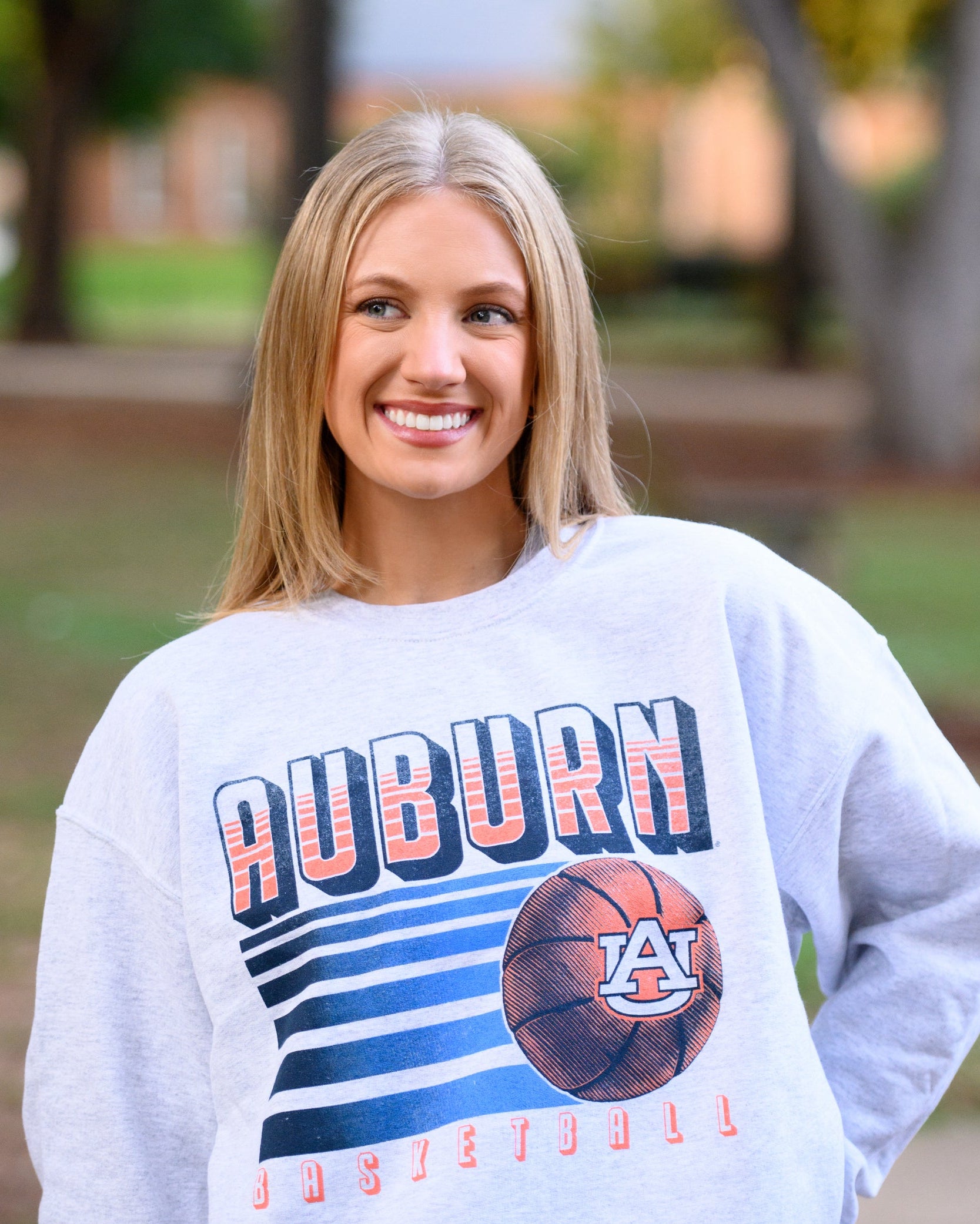 Auburn University Auburn Basketball Vintage White Gildan Sweatshirt with retro style Orange text "Auburn" and an image of a basketball with the AU Logo