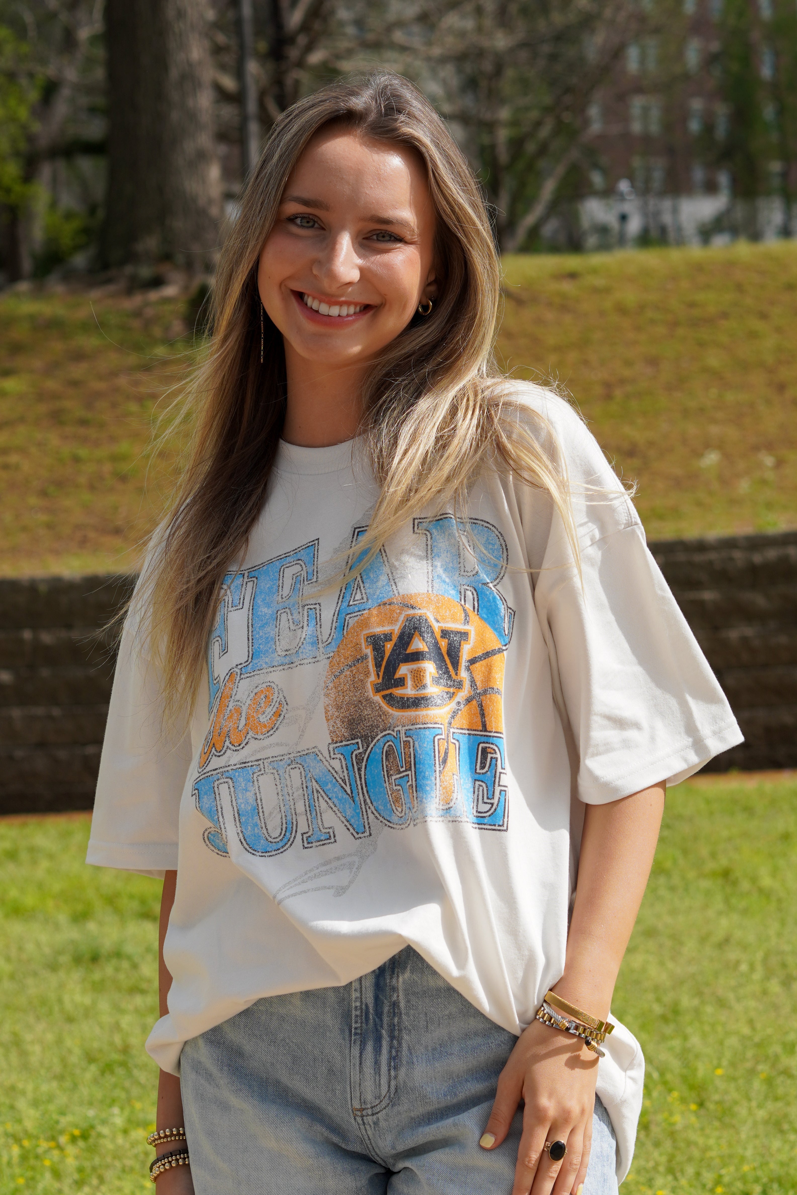Auburn University Off-White T-Shirt with 'FEAR THE JUNGLE' text, a basketball with the AU Logo and tiger claw marks design